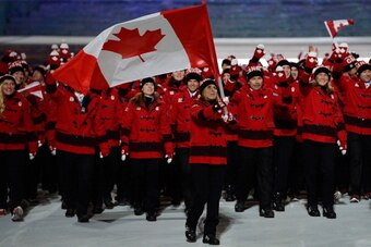 SOCHI, RUSSIA - FEBRUARY 07:  Ice hockey player Hayley Wickenheiser of the Canada Olympic team carries her country's flag during the Opening Ceremony of the Sochi 2014 Winter Olympics at Fisht Olympic Stadium on February 7, 2014 in Sochi, Russia.  (Photo 