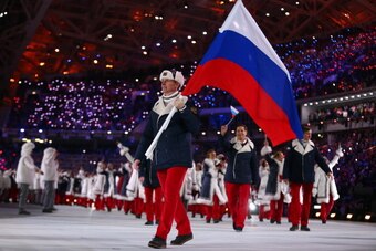 SOCHI, RUSSIA - FEBRUARY 07:  Bobsleigh racer Alexander Zubkov of the Russia Olympic team carries his country's flag during the Opening Ceremony of the Sochi 2014 Winter Olympics at Fisht Olympic Stadium on February 7, 2014 in Sochi, Russia.  (Photo by Ry