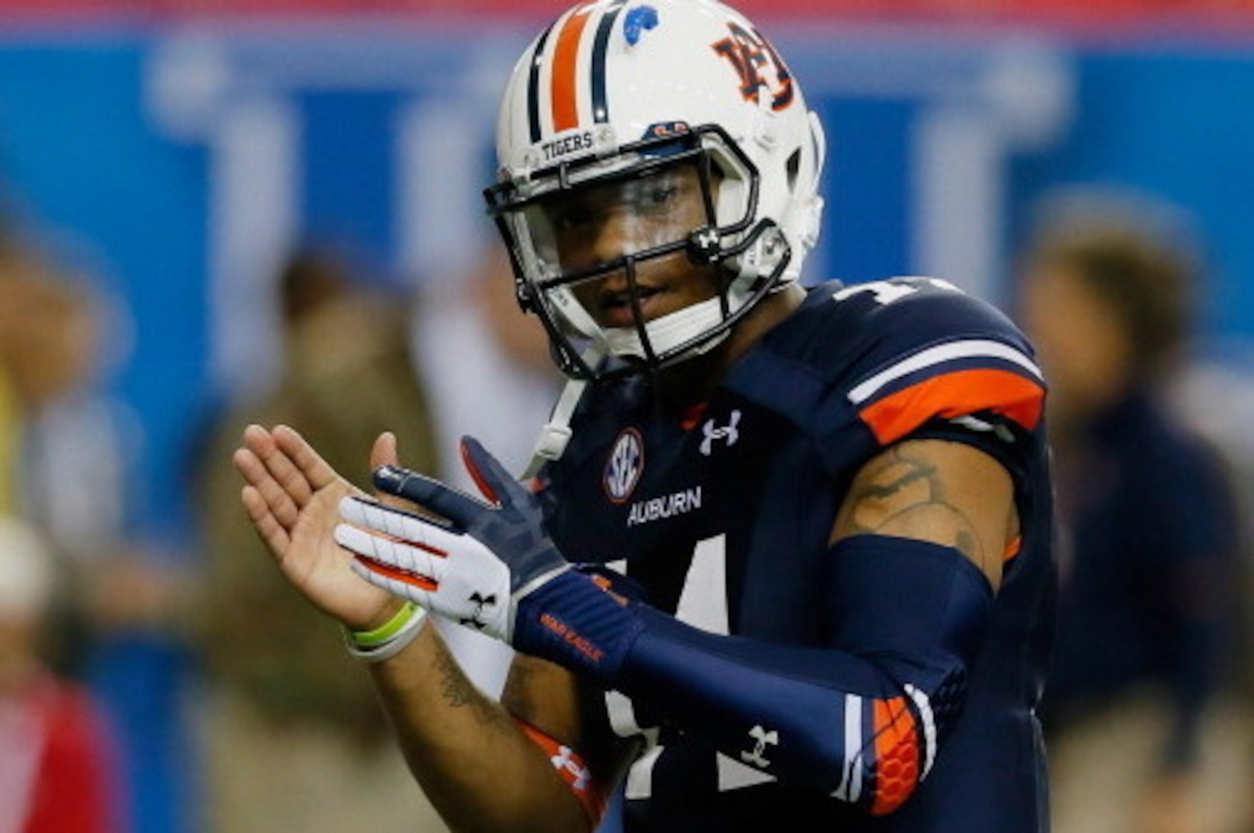 ATLANTA, GA - DECEMBER 07: Quarterback Nick Marshall #14 of the Auburn Tigers warms up before playing against the Missouri Tigers during the SEC Championship Game at Georgia Dome on December 7, 2013 in Atlanta, Georgia. (Photo by Kevin C. Cox/Getty Imag ATLANTA, GA - DECEMBER 07: Quarterback Nick Marshall #14 of the Auburn Tigers warms up before playing against the Missouri Tigers during the SEC Championship Game at Georgia Dome on December 7, 2013 in Atlanta, Georgia. (Photo by Kevin C. Cox/Getty Imag