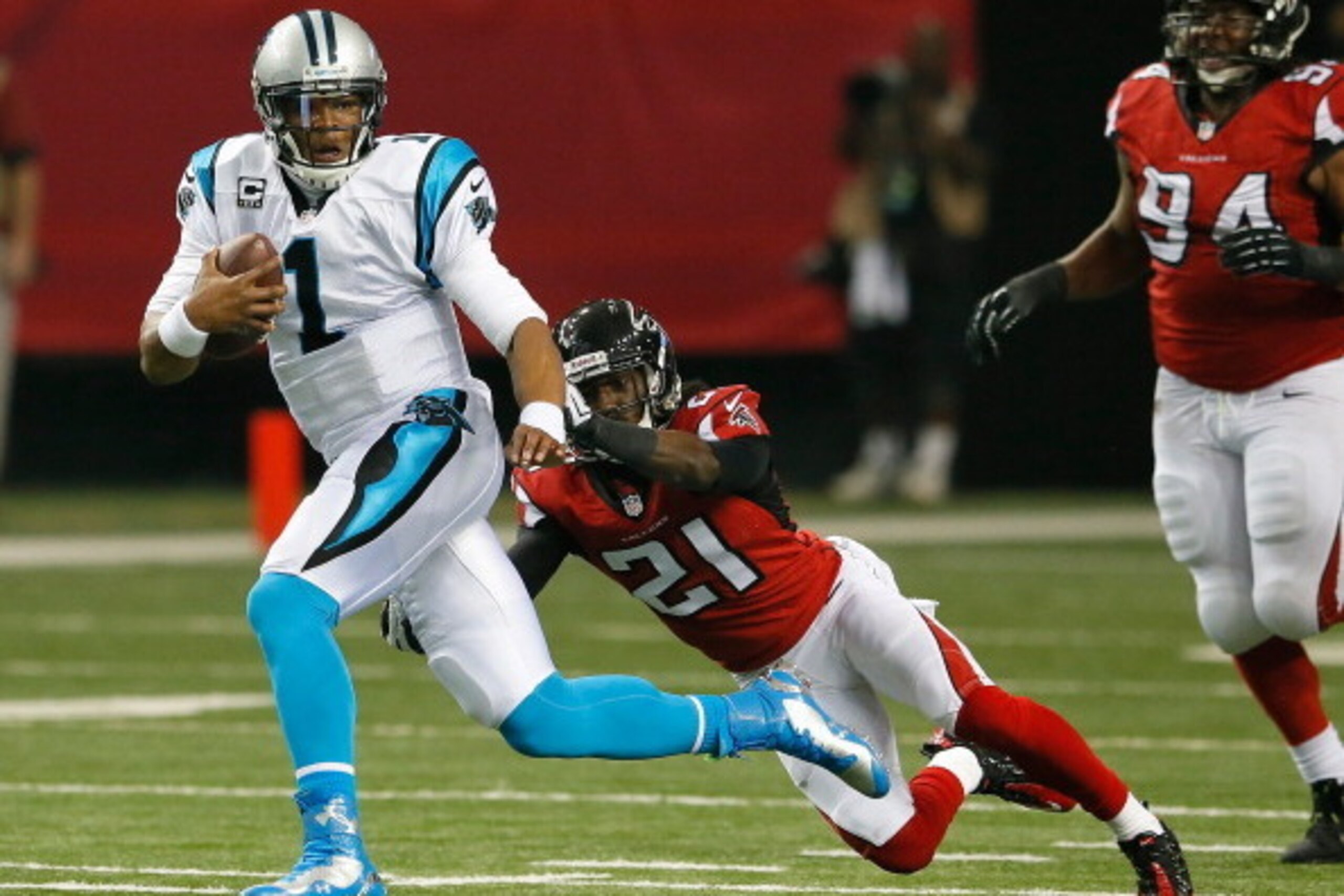 ATLANTA, GA - DECEMBER 29:  Cam Newton #1 of the Carolina Panthers rushes against Desmond Trufant #21 of the Atlanta Falcons at Georgia Dome on December 29, 2013 in Atlanta, Georgia.  (Photo by Kevin C. Cox/Getty Images)