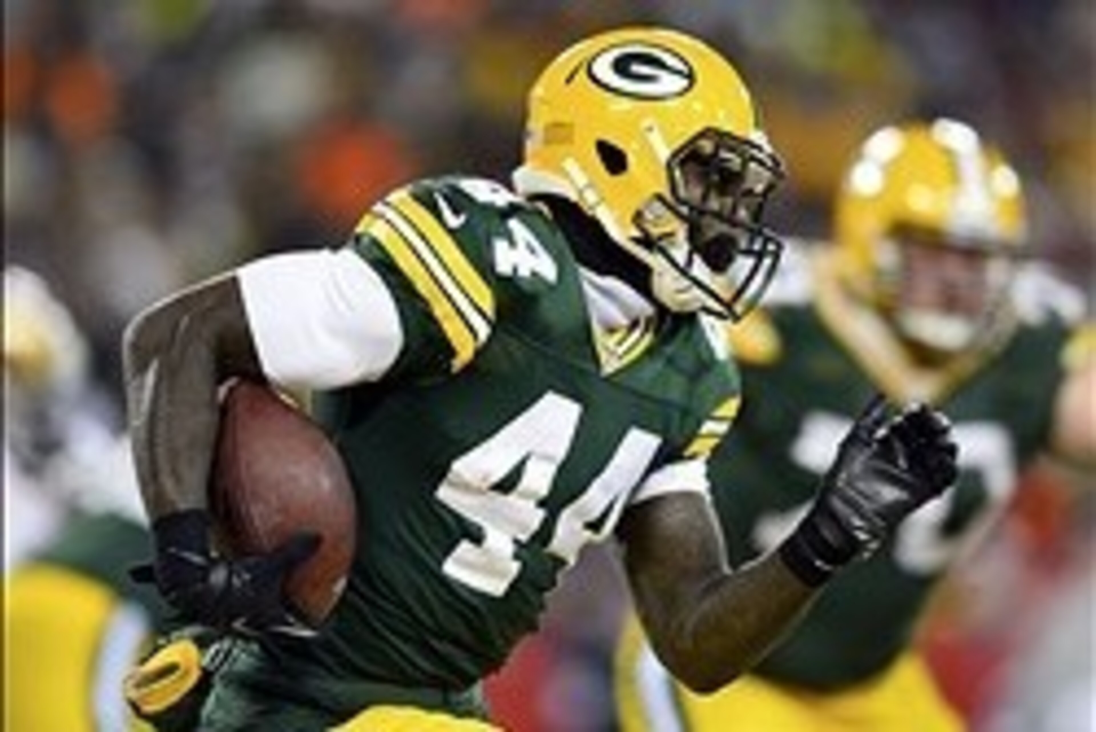 Jan 5, 2014; Green Bay, WI, USA; Green Bay Packers running back James Starks (44) rushes the ball against the San Francisco 49ers during the second half of the 2013 NFC wild card playoff football game at Lambeau Field. San Francisco 49ers defeat the Green