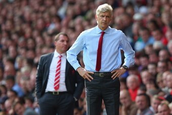 LIVERPOOL, ENGLAND - SEPTEMBER 02:  Arsene Wenger the manager of Arsenal and Brendan Rodgers the manager of Liverpool look on during the Barclays Premier League match between Liverpool and  Arsenal at Anfield on September 2, 2012 in Liverpool, England.  (