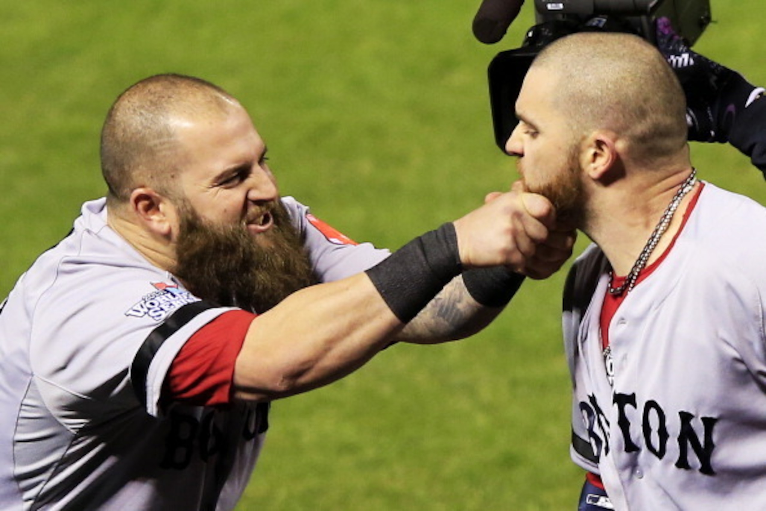 ST LOUIS, MO - OCTOBER 27:  Mike Napoli #12 of the Boston Red Sox pulls teammate Jonny Gomes #5 beard after hitting a three run home run to left field against Seth Maness #61 of the St. Louis Cardinals in the sixth inning during Game Four of the 2013 Worl