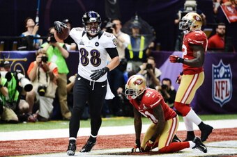 NEW ORLEANS, LA - FEBRUARY 03:  Dennis Pitta #88 of the Baltimore Ravens reacts after he caught a 1-yard touchdown pass in the second quarter against Donte Whitner #31 of the San Francisco 49ers during Super Bowl XLVII at the Mercedes-Benz Superdome on Fe