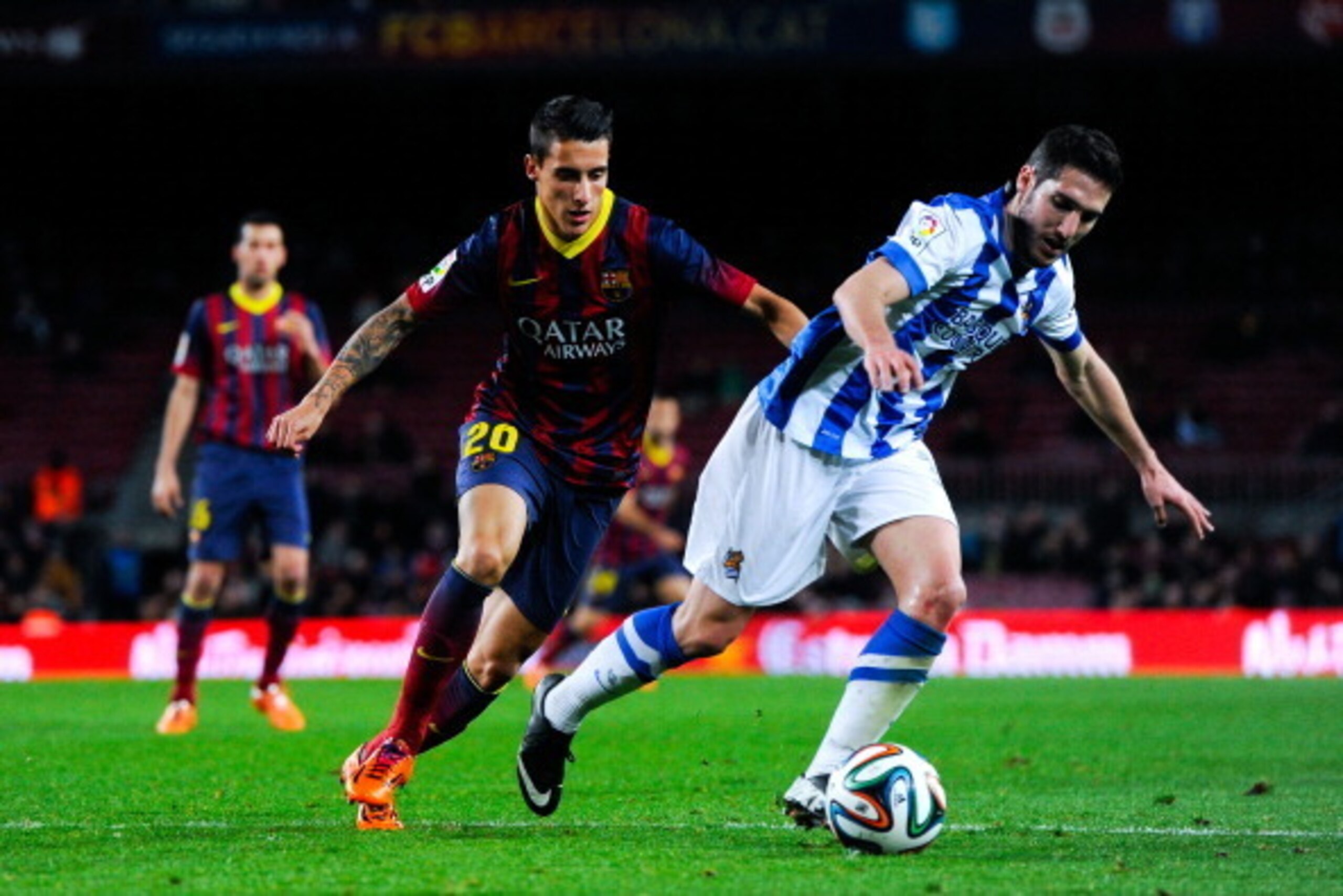BARCELONA, SPAIN - FEBRUARY 05:  Cristian Tello of FC Barcelona duels for the ball with Zaldua of Real Sociedad during the Copa del Rey Semi-Final first leg match between Barcelona and Real Sociedad at Camp Nou on February 5, 2014 in Barcelona, Spain.  (P