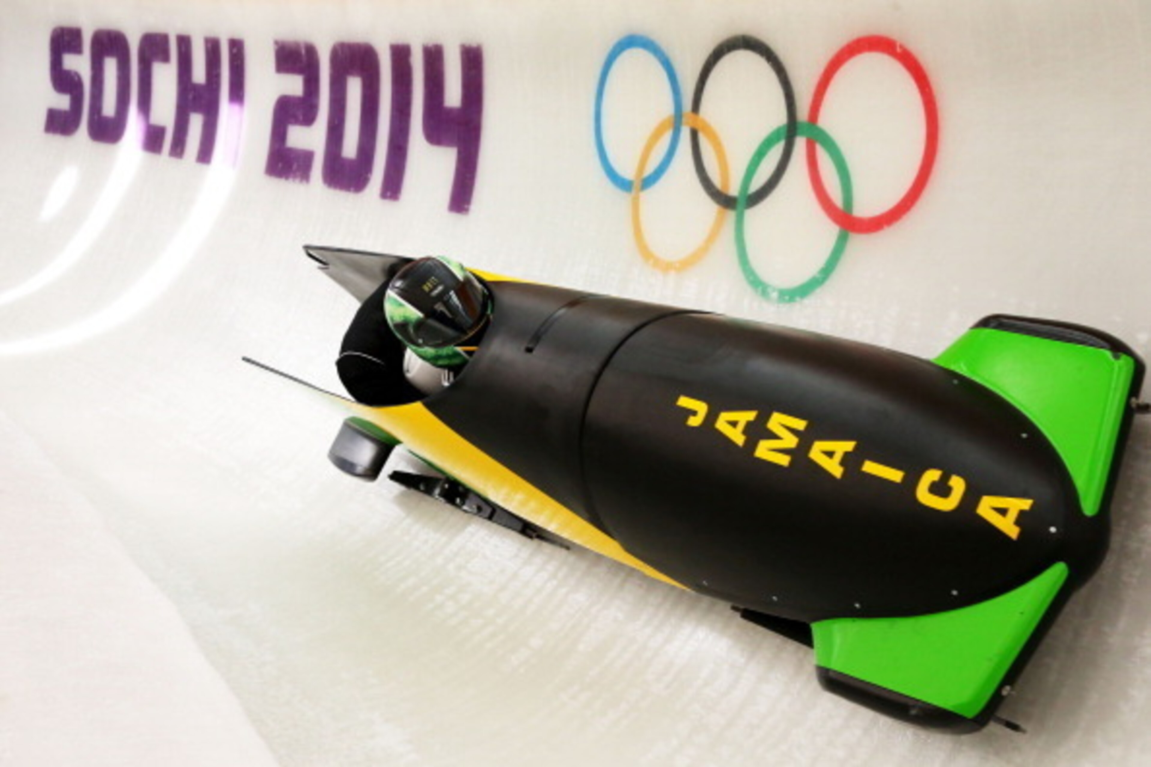SOCHI, RUSSIA - FEBRUARY 06:  Winston Watts of Jamaica pilots a bobsleigh practice run ahead of the Sochi 2014 Winter Olympics at the Sanki Sliding Center on February 6, 2014 in Sochi, Russia.  (Photo by Alex Livesey/Getty Images)