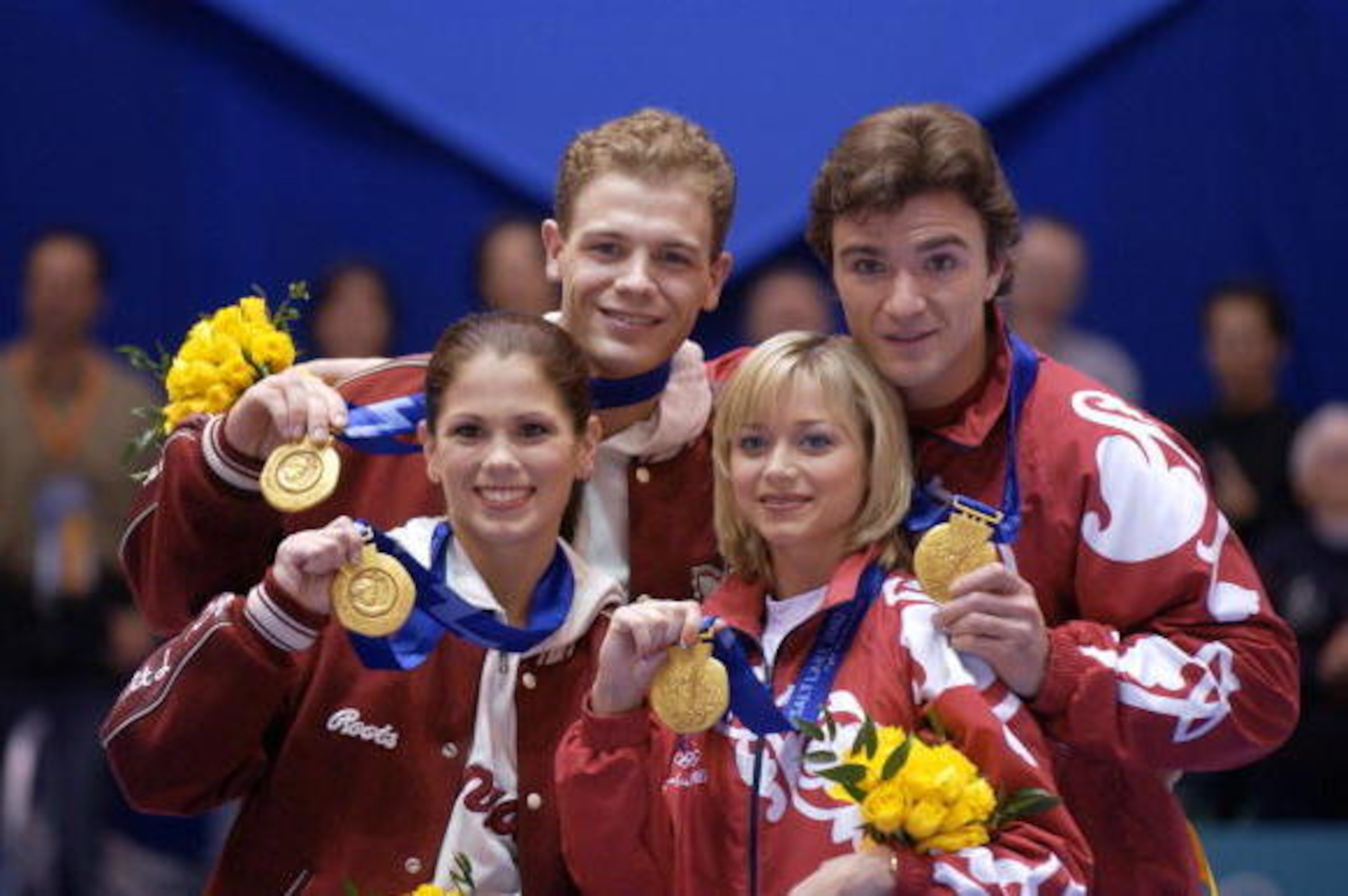 17 Feb 2002: (L-R) David Pelletier and Jamie Sale of Canada stand on the podium with Anton Sikharulidze and Elena Berezhnaya of Russia and pose with their gold medals in the pairs during the Salt Lake City Winter Olympic Games at the Salt Lake Ice Centeri 17 Feb 2002: (L-R) David Pelletier and Jamie Sale of Canada stand on the podium with Anton Sikharulidze and Elena Berezhnaya of Russia and pose with their gold medals in the pairs during the Salt Lake City Winter Olympic Games at the Salt Lake Ice Centeri