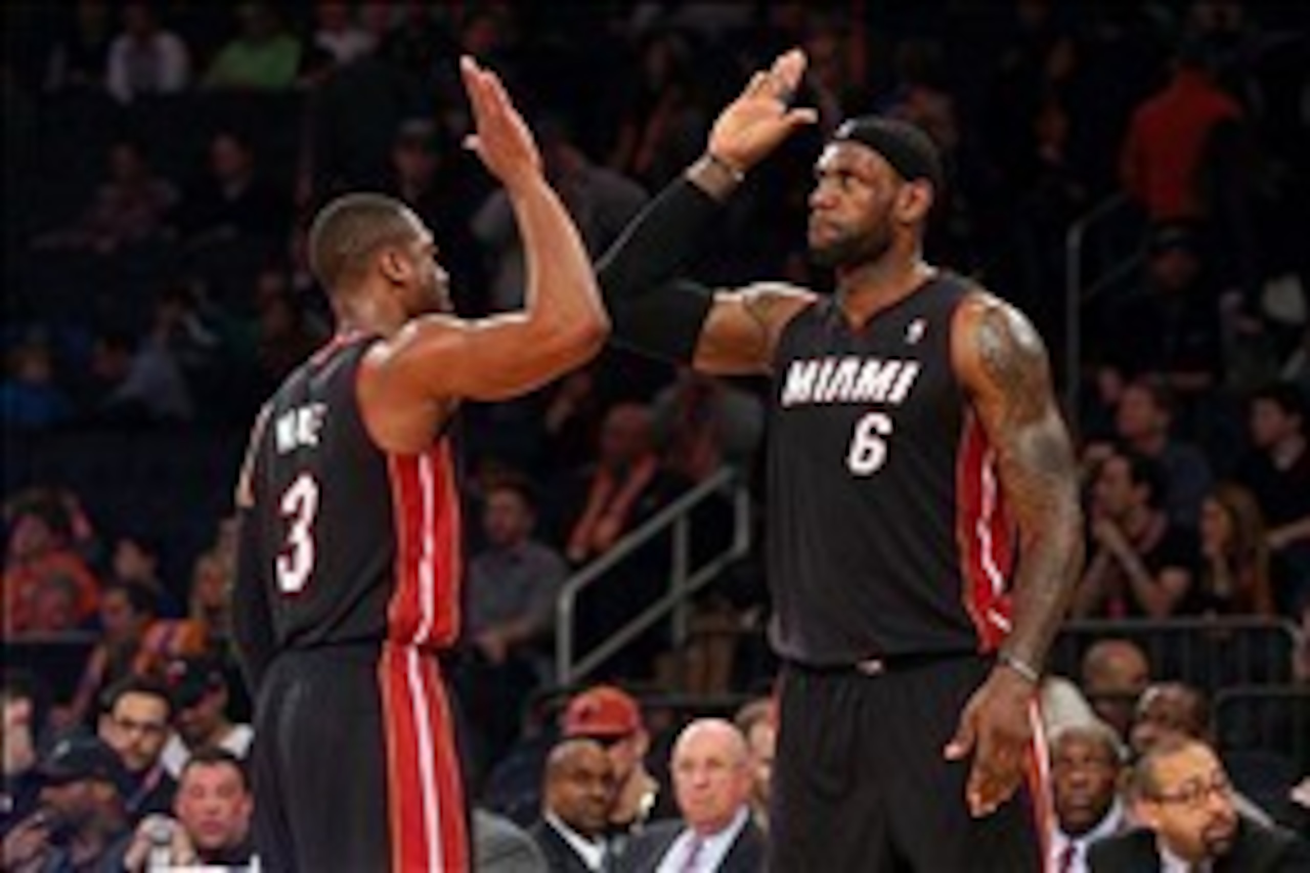 Feb 1, 2014; New York, NY, USA; Miami Heat small forward LeBron James (6) high fives Heat shooting guard Dwyane Wade (3) during the fourth quarter of a game against the New York Knicks at Madison Square Garden. The Heat defeated the Knicks 106-91. Mandato