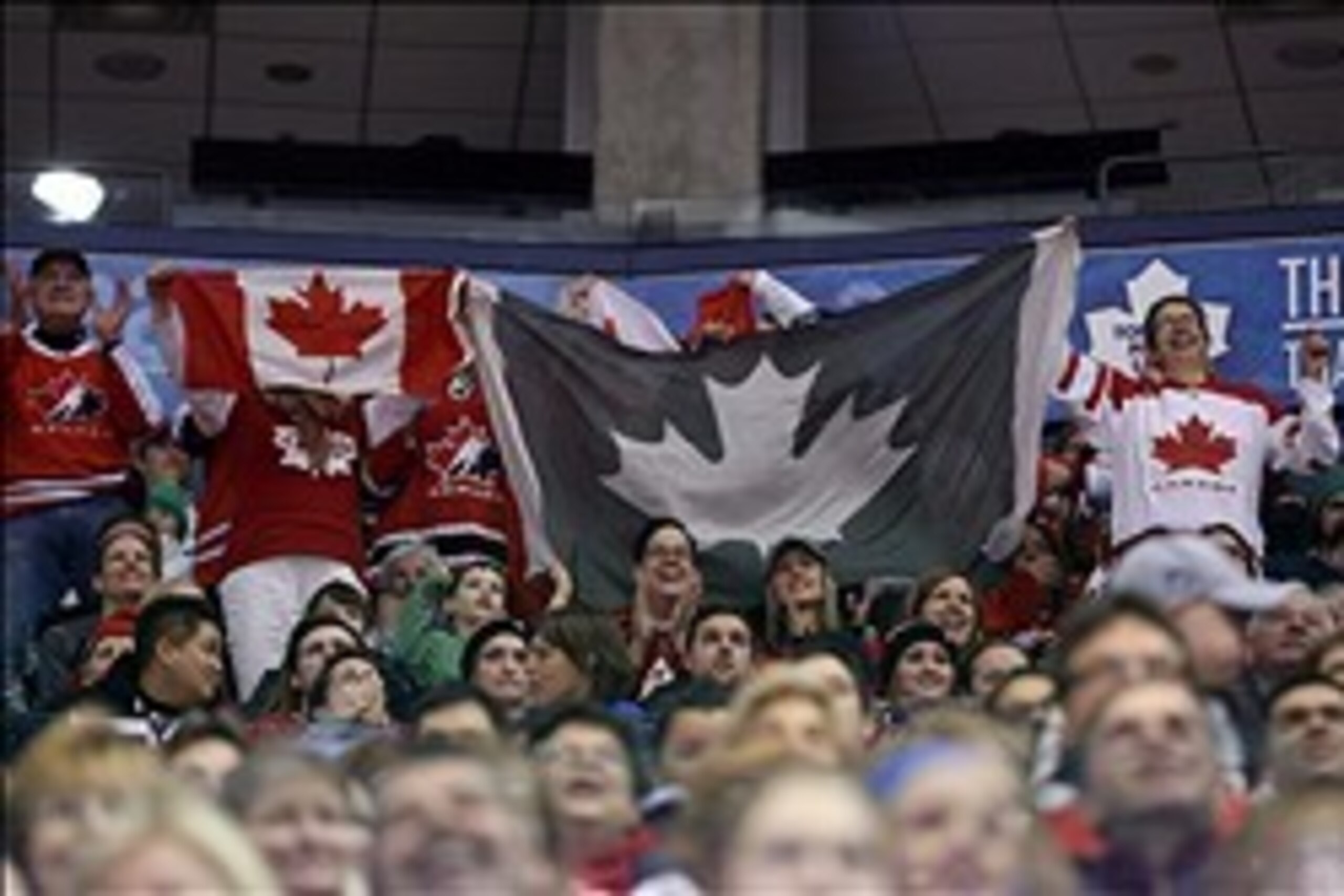 Dec 30, 2013; Toronto, Ontario, Canada; Canada fans wave Canadian flags against USA during the first period in an exhibition hockey game at Air Canada Centre. USA beat Canada 3-2. Mandatory Credit: Tom Szczerbowski-USA TODAY Sports Dec 30, 2013; Toronto, Ontario, Canada; Canada fans wave Canadian flags against USA during the first period in an exhibition hockey game at Air Canada Centre. USA beat Canada 3-2. Mandatory Credit: Tom Szczerbowski-USA TODAY Sports