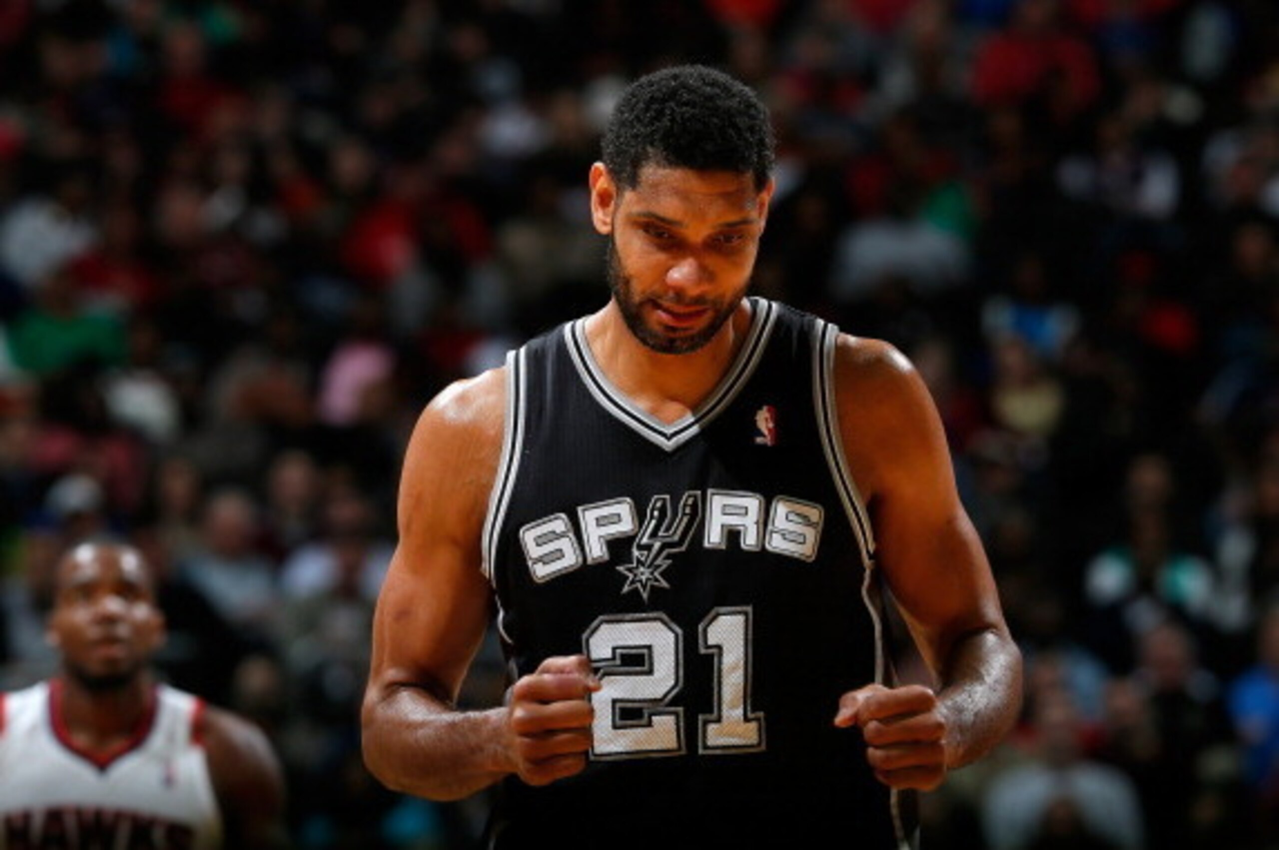 ATLANTA, GA - JANUARY 24:  Tim Duncan #21 of the San Antonio Spurs reacts after a basket against the Atlanta Hawks at Philips Arena on January 24, 2014 in Atlanta, Georgia.  NOTE TO USER: User expressly acknowledges and agrees that, by downloading and or