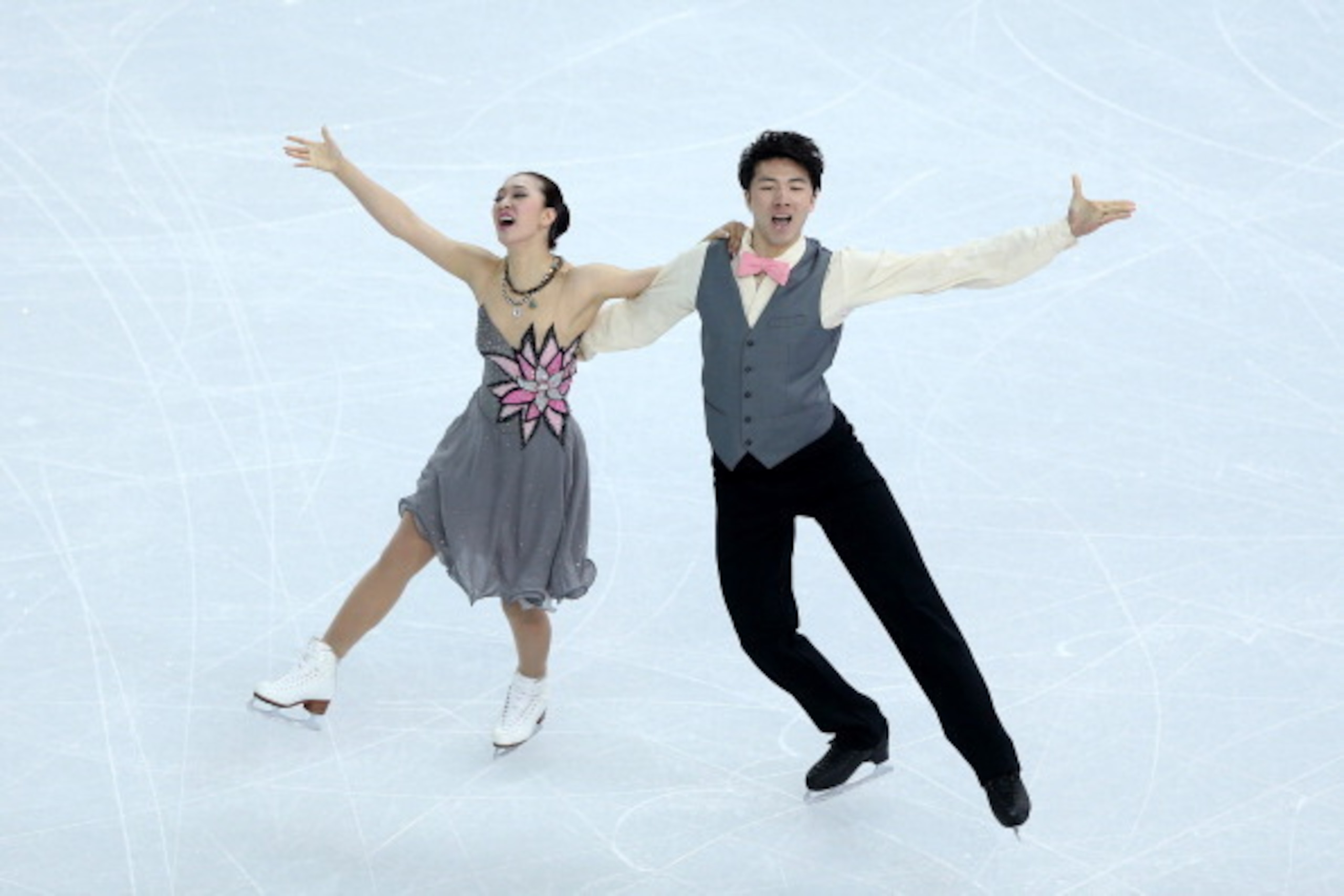 SOCHI, RUSSIA - FEBRUARY 08:  Xintong Huang and Xun Zheng of China compete in the Figure Skating Team Ice Dance - Short Dance during day one of the Sochi 2014 Winter Olympics at Iceberg Skating Palace on February 8, 2014 in Sochi, Russia.  (Photo by Matth
