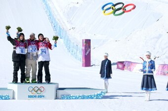 SOCHI, RUSSIA - FEBRUARY 08:  (L-R) Silver medalist Staale Sandbech of Norway, gold medalist Sage Kotsenburg of the United States and bronze medalist Mark McMorris of Canada pose on the podium during the flower ceremony following the Snowboard Men's Slope