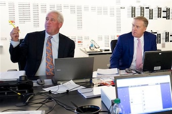 A big board behind John Fox and John Elway