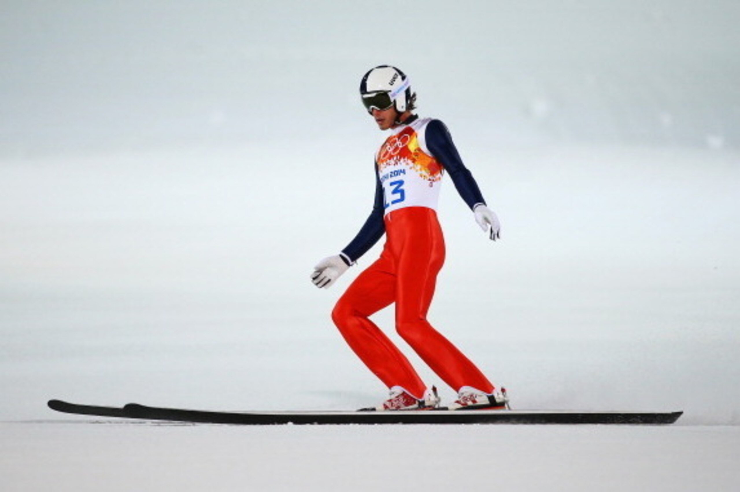 SOCHI, RUSSIA - FEBRUARY 08: Anders Johnson of the United States lands after a jump during the Men's Normal Hill Individual Qualification on day 1 of the Sochi 2014 Winter Olympics at the RusSki Gorki Ski Jumping Center on February 8, 2014 in Sochi, Russi