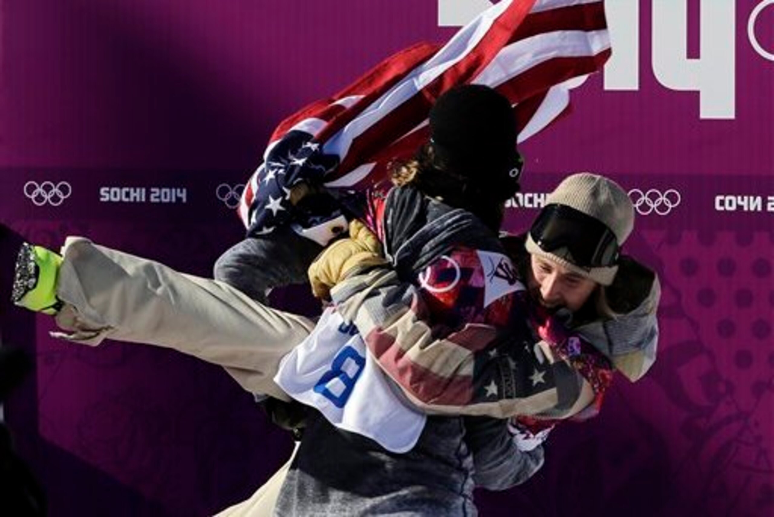 Getting tackled—in a happy way—by the silver medalist. Getting tackled—in a happy way—by the silver medalist.