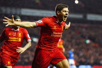 LIVERPOOL, ENGLAND - JANUARY 28:  Steven Gerrard of Liverpool celebrates after scoring the opening goal during the Barclays Premier League match between Liverpool and Everton at Anfield on January 28, 2014 in Liverpool, England.  (Photo by Laurence Griffi