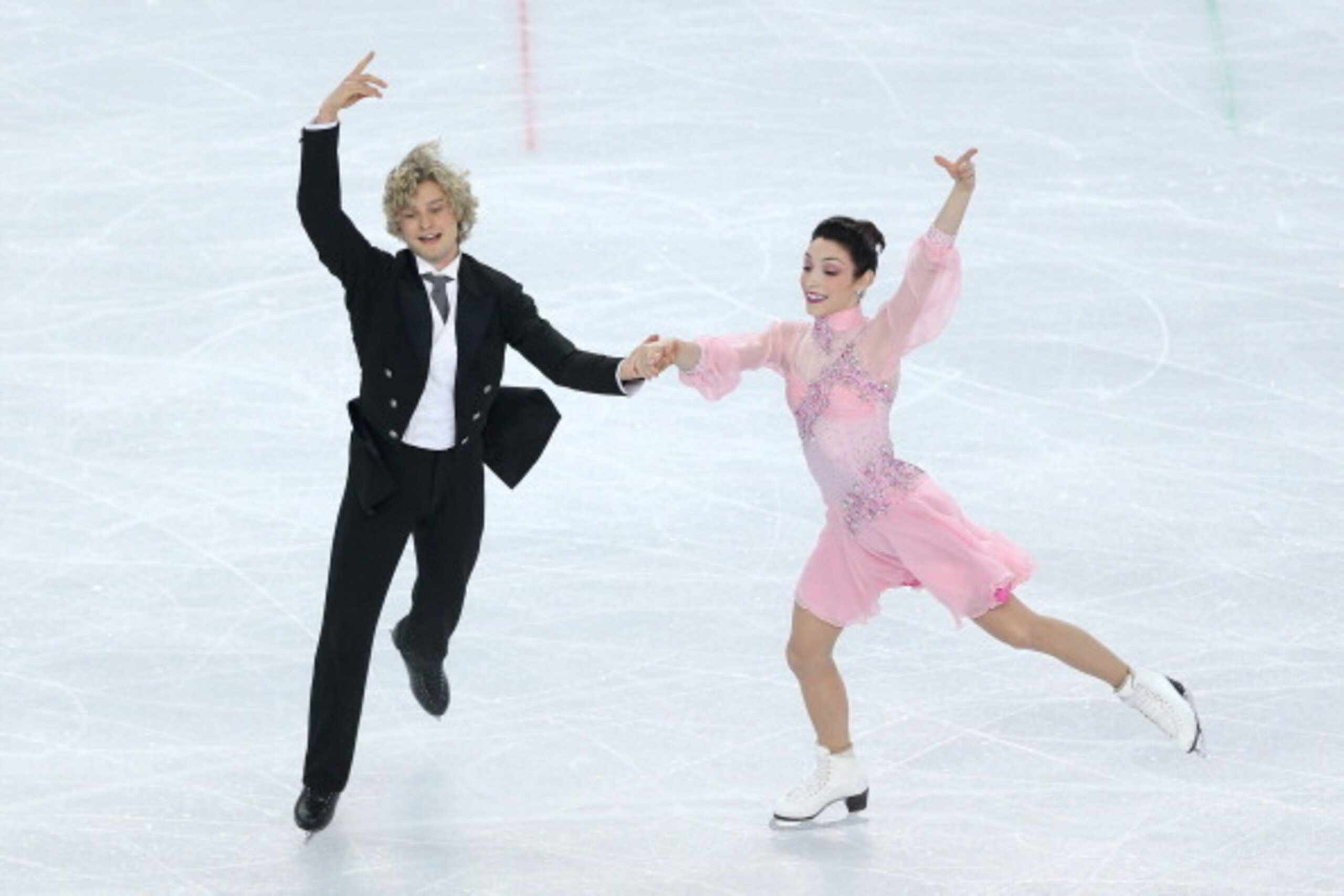 SOCHI, RUSSIA - FEBRUARY 08:  Meryl Davis and Charlie White of the United States compete in the Figure Skating Team Ice Dance - Short Dance during day one of the Sochi 2014 Winter Olympics at Iceberg Skating Palace on February 8, 2014 in Sochi, Russia.  (