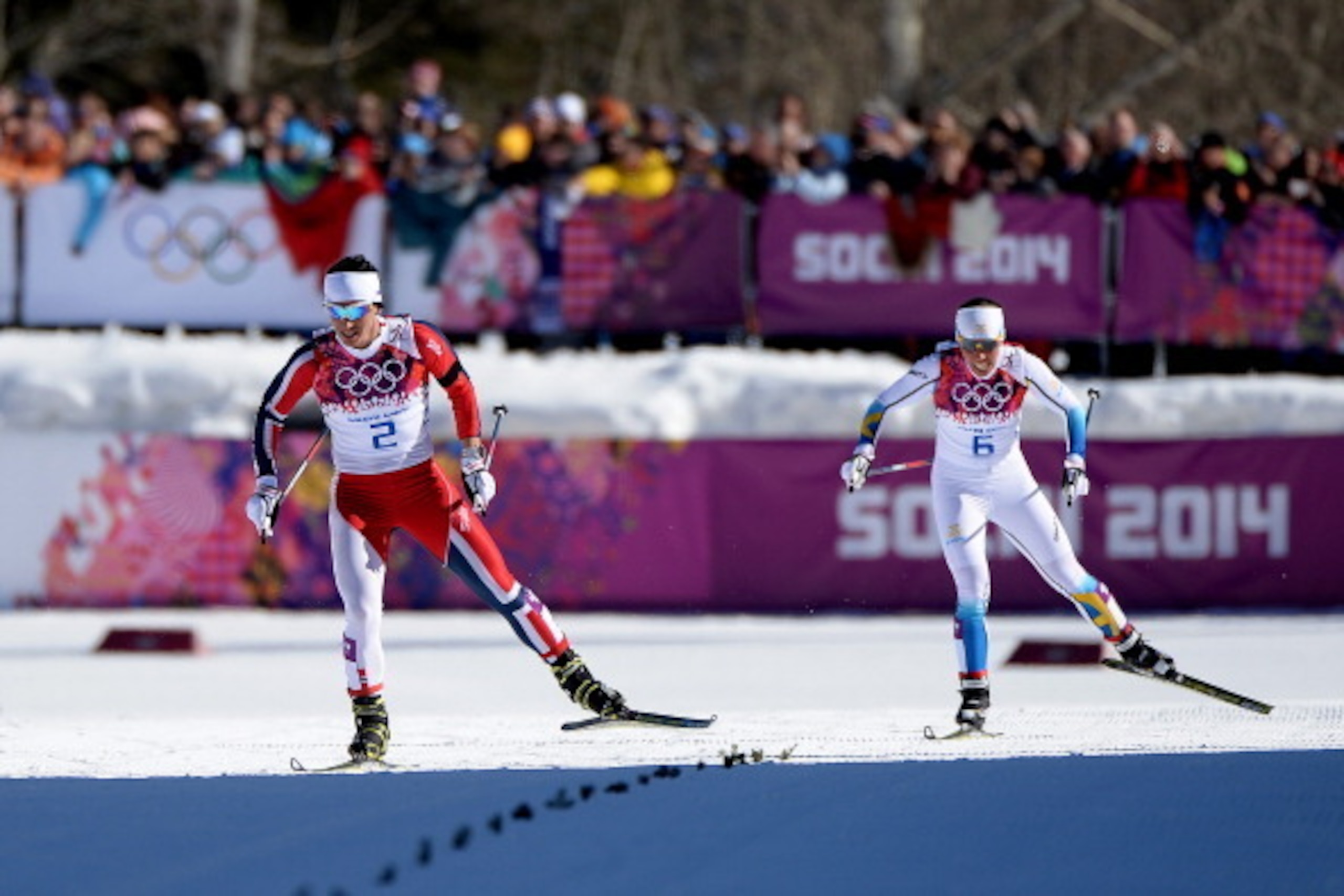 SOCHI, RUSSIA - FEBRUARY 08:  Marit Bjoergen of Norway approaches the finish line ahead of Charlotte Kalla of Sweden to win gold in the Ladies' Skiathlon 7.5 km Classic + 7.5 km Free during day one of the Sochi 2014 Winter Olympics at Laura Cross-country 