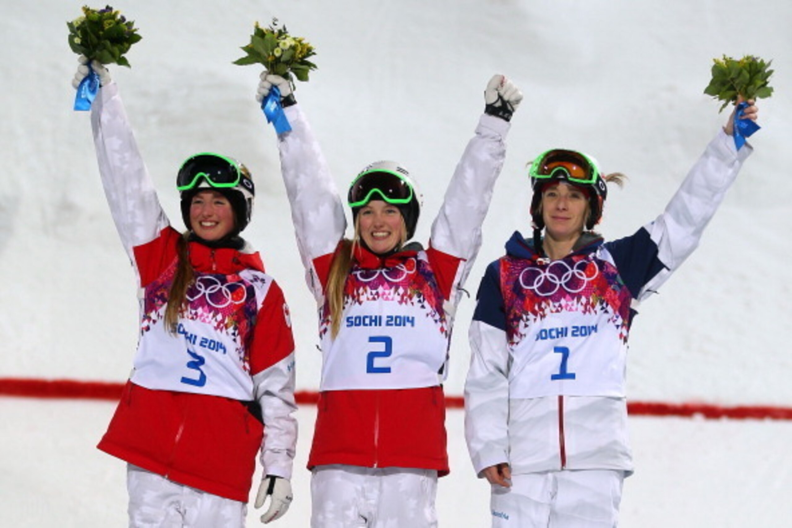 SOCHI, RUSSIA - FEBRUARY 08: (L-R) Silver medalist Chloe Dufour-Lapointe of Canada, gold medalist Justine Dufour-Lapointe of Canada and bronze medalist Hannah Kearney of the United States pose on the podium during the flower ceremony following the Ladies SOCHI, RUSSIA - FEBRUARY 08: (L-R) Silver medalist Chloe Dufour-Lapointe of Canada, gold medalist Justine Dufour-Lapointe of Canada and bronze medalist Hannah Kearney of the United States pose on the podium during the flower ceremony following the Ladies