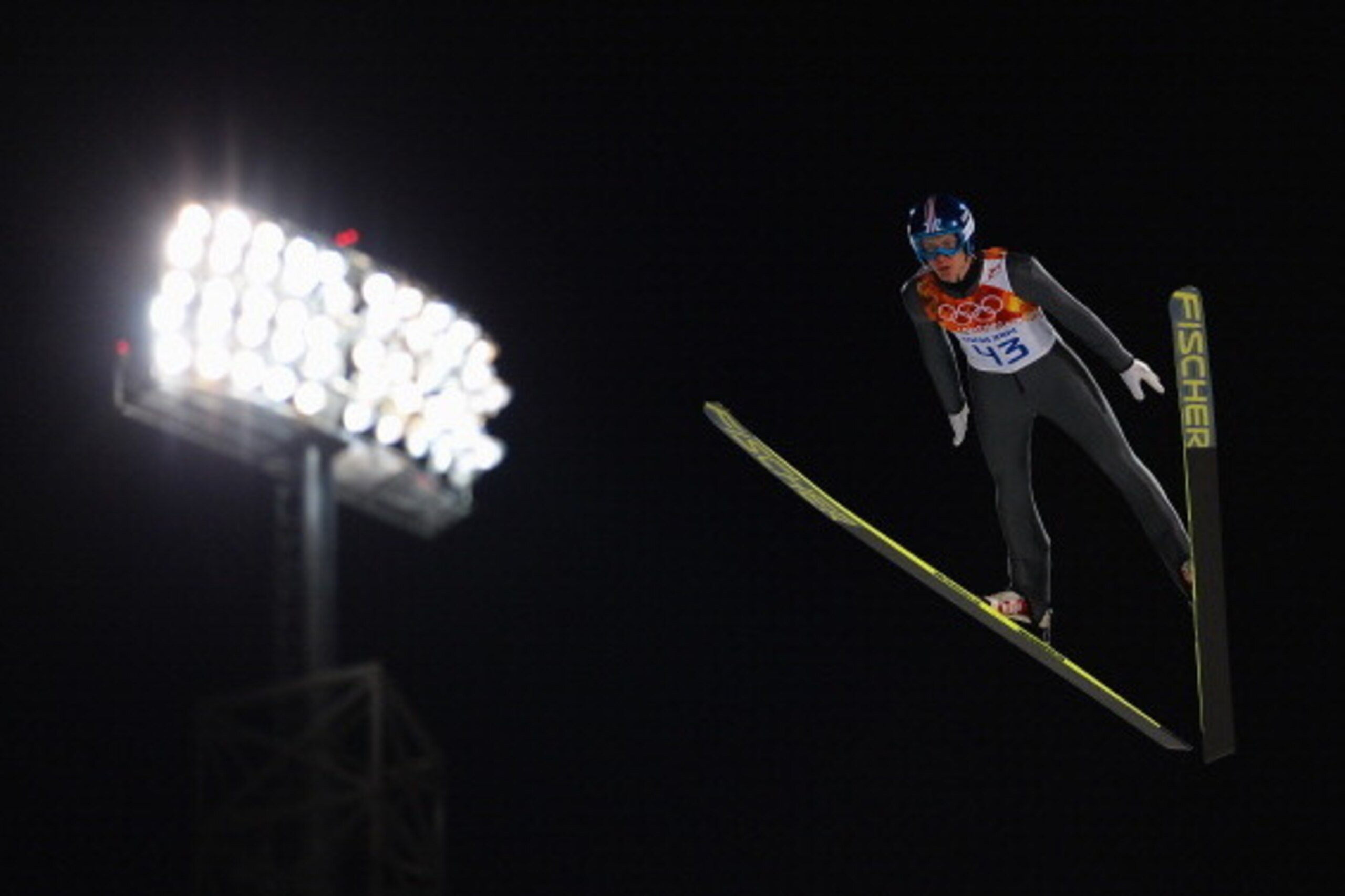 SOCHI, RUSSIA - FEBRUARY 08: Michael Hayboeck of Austria jumps during the Men's Normal Hill Individual Qualification on day 1 of the Sochi 2014 Winter Olympics at the RusSki Gorki Ski Jumping Center on February 8, 2014 in Sochi, Russia.  (Photo by Lars Ba