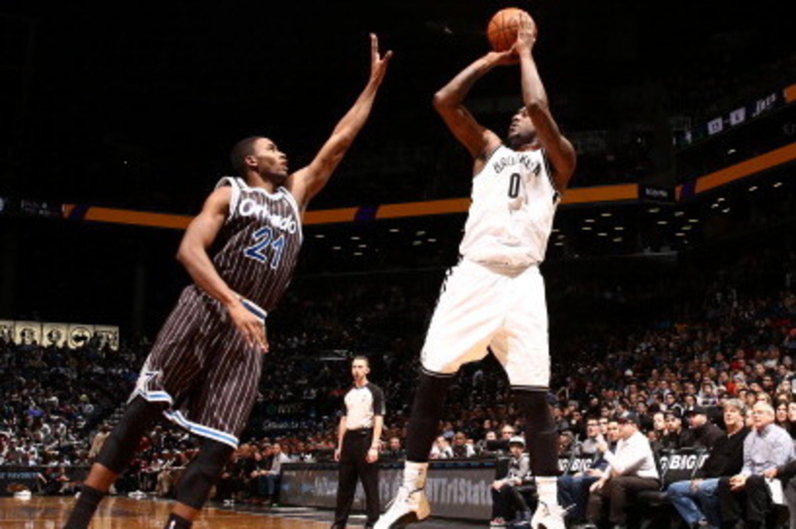 NEW YORK, NY - JANUARY 21: Andray Blatche #0 of the Brooklyn Nets shoots against Maurice Harkless #21 of the Orlando Magic during a game at the Barclays Center on January 21, 2014 in the Brooklyn borough of New York City.  NOTE TO USER: User expressly ack