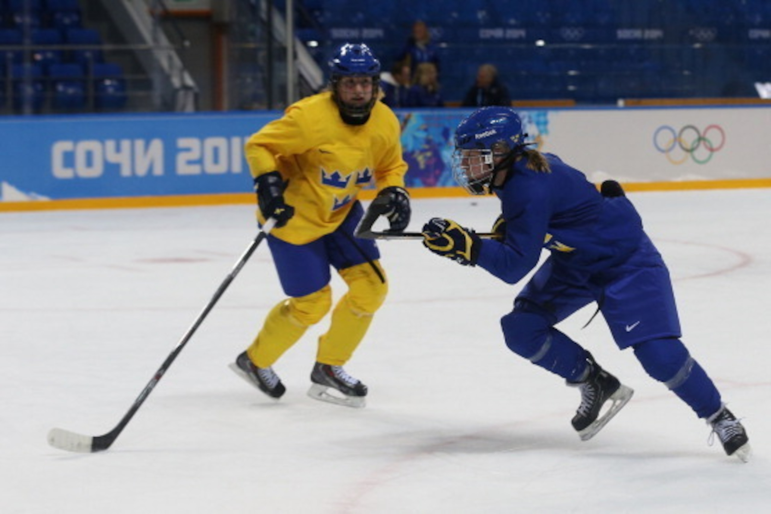 SOCHI, RUSSIA - FEBRUARY 05: Emma Eliasson #22 and Pernilla Winberg #16 of Sweden practice during a women's ice hockey training session ahead of the Sochi 2014 Winter Olympics at Shayba Arena on February 5, 2014 in Sochi, Russia.  (Photo by Bruce Bennett/