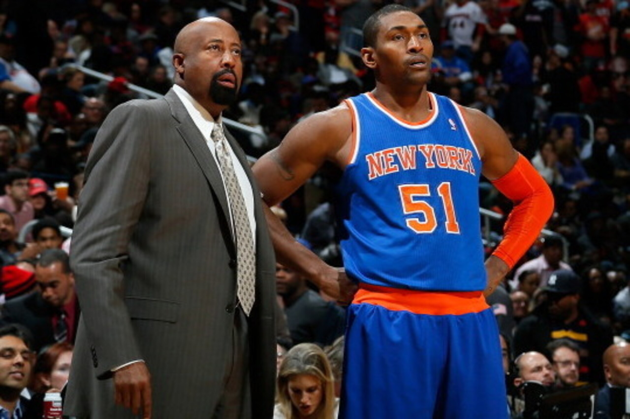 ATLANTA, GA - NOVEMBER 13:  Mike Woodson of the New York Knicks looks on during free throws with Metta World Peace #51 against the Atlanta Hawks at Philips Arena on November 13, 2013 in Atlanta, Georgia.  NOTE TO USER: User expressly acknowledges and agre