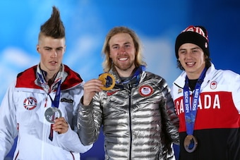 SOCHI, RUSSIA - FEBRUARY 08:  (L-R) Silver medalist Staale Sandbech of Norway, gold medalist Sage Kotsenburg of the United States and bronze medalist Mark McMorris of Canada on the podium during the medal ceremony for the for the Snowboard Men's Slopestyl