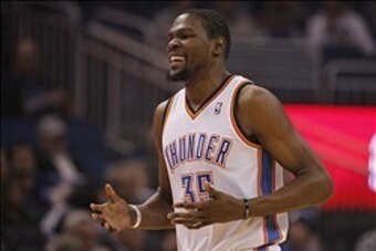 Feb 7, 2014; Orlando, FL, USA; Oklahoma City Thunder small forward Kevin Durant (35) reacts against the Orlando Magic during the first half at Amway Center. Mandatory Credit: Kim Klement-USA TODAY Sports