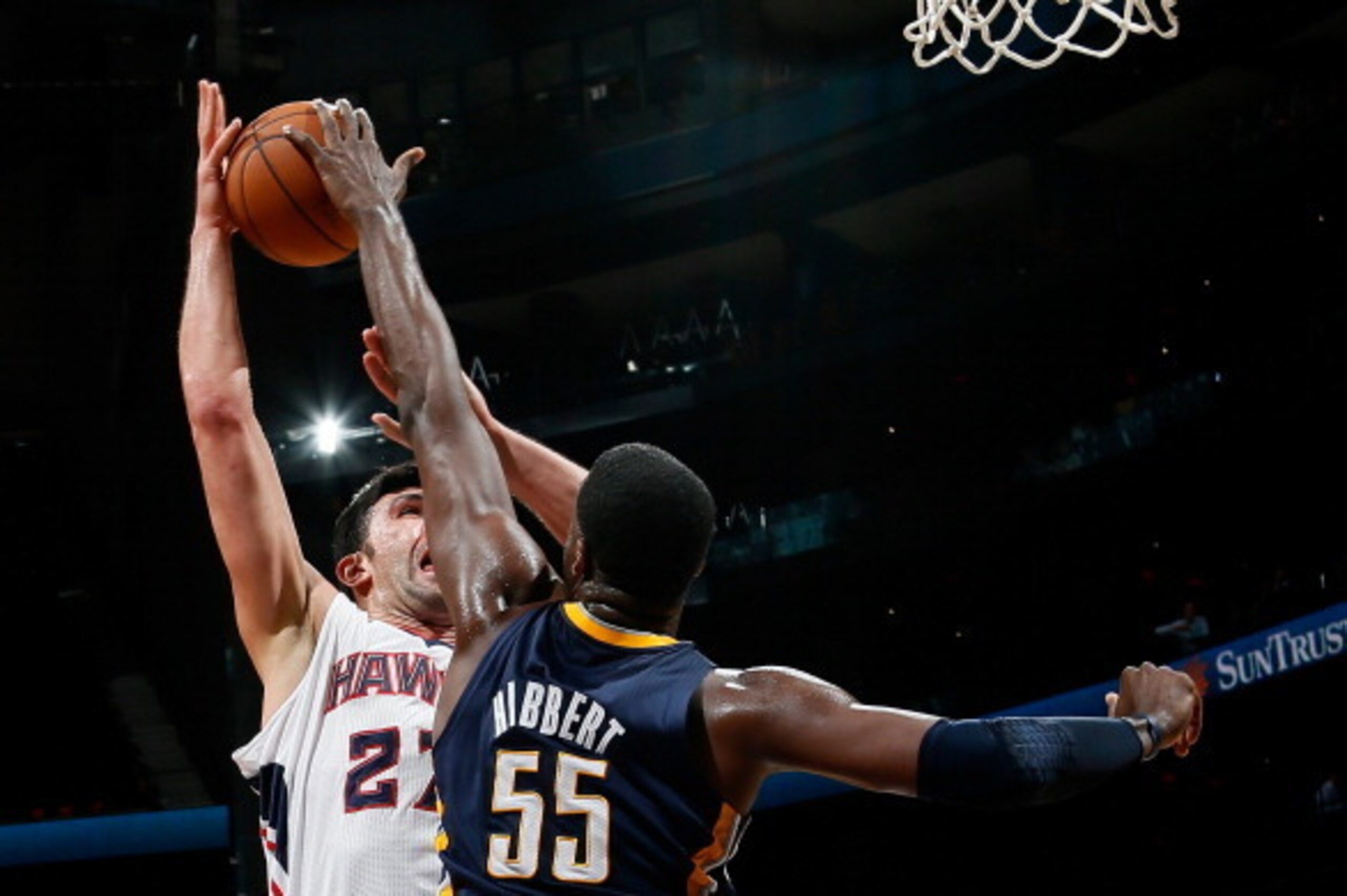 ATLANTA, GA - NOVEMBER 07:  Roy Hibbert #55 of the Indiana Pacers blocks a shot by Zaza Pachulia #27 of the Atlanta Hawks at Philips Arena on November 7, 2012 in Atlanta, Georgia.  NOTE TO USER: User expressly acknowledges and agrees that, by downloading 