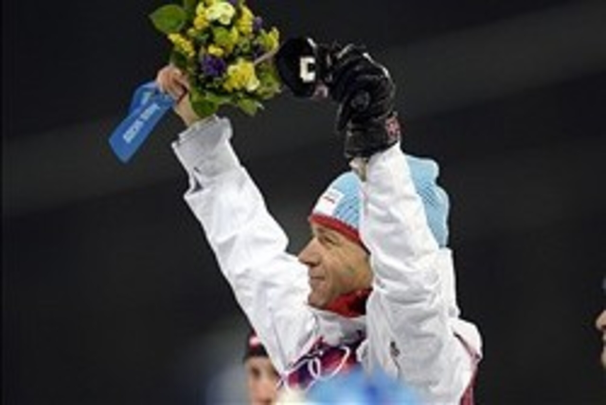 Feb 8, 2014; Krasnaya Polyana, RUSSIA; Ole Einar Bjoerndalen (NOR) celebrates at the flower ceremony during the Sochi 2014 Olympic Winter Games at Laura Cross-Country Ski and Biathlon Center. Mandatory Credit: Jack Gruber-USA TODAY Sports