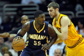 Jan 5, 2014; Cleveland, OH, USA; Indiana Pacers center Roy Hibbert (55) dribbles against Cleveland Cavaliers center Tyler Zeller (40) in the first quarter at Quicken Loans Arena. Mandatory Credit: David Richard-USA TODAY Sports