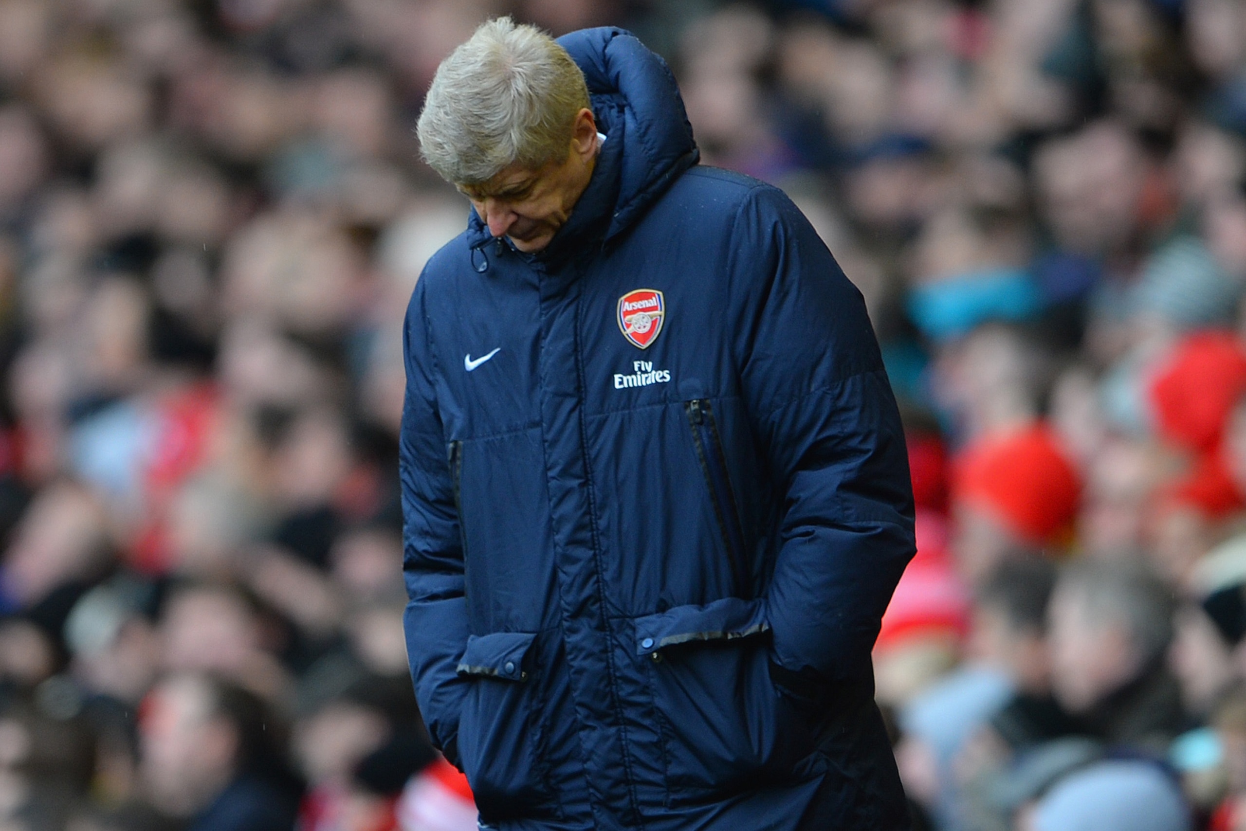 LIVERPOOL, ENGLAND - FEBRUARY 08: Arsenal Manager Arsene Wenger looks dejected during the Barclays Premier League match between Liverpool and Arsenal at Anfield on February 8, 2014 in Liverpool, England. (Photo by Michael Regan/Getty Images) LIVERPOOL, ENGLAND - FEBRUARY 08: Arsenal Manager Arsene Wenger looks dejected during the Barclays Premier League match between Liverpool and Arsenal at Anfield on February 8, 2014 in Liverpool, England. (Photo by Michael Regan/Getty Images)