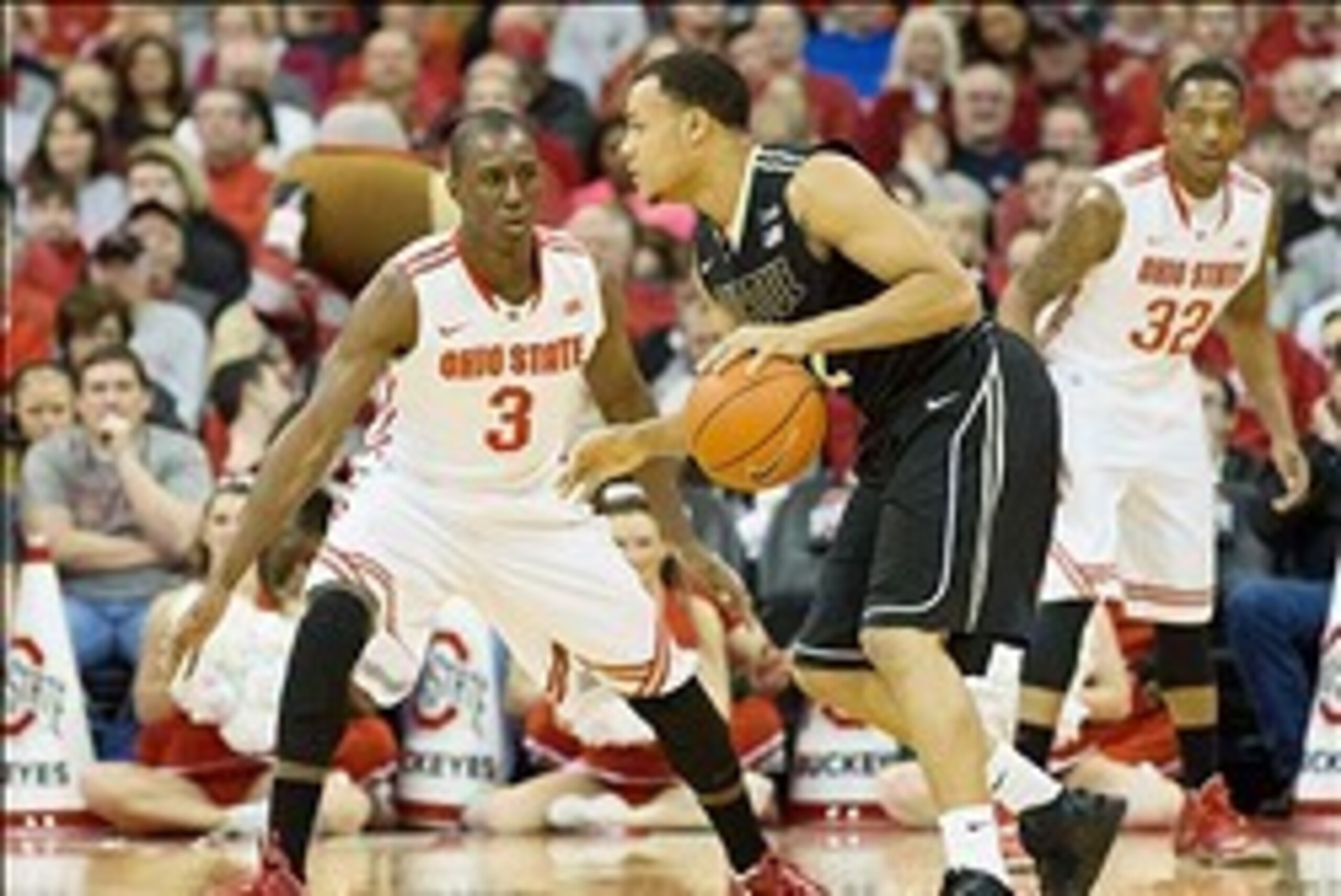 Feb 8, 2014; Columbus, OH, USA; Purdue Boilermakers guard Bryson Scott (12) dribbles as Ohio State Buckeyes guard Shannon Scott (3) defends at the Schottenstein Center. Ohio State won the game 67-49. Mandatory Credit: Greg Bartram-USA TODAY Sports