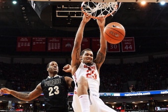 COLUMBUS, OH - FEBRUARY 8: Amir Williams #23 of the Ohio State Buckeyes slams home two points in the first half over Jay Simpson #23 of the Purdue Boilermakers on February 8, 2014 at Value City Arena in Columbus, Ohio. Ohio State defeated Purdue 67-49. COLUMBUS, OH - FEBRUARY 8: Amir Williams #23 of the Ohio State Buckeyes slams home two points in the first half over Jay Simpson #23 of the Purdue Boilermakers on February 8, 2014 at Value City Arena in Columbus, Ohio. Ohio State defeated Purdue 67-49.