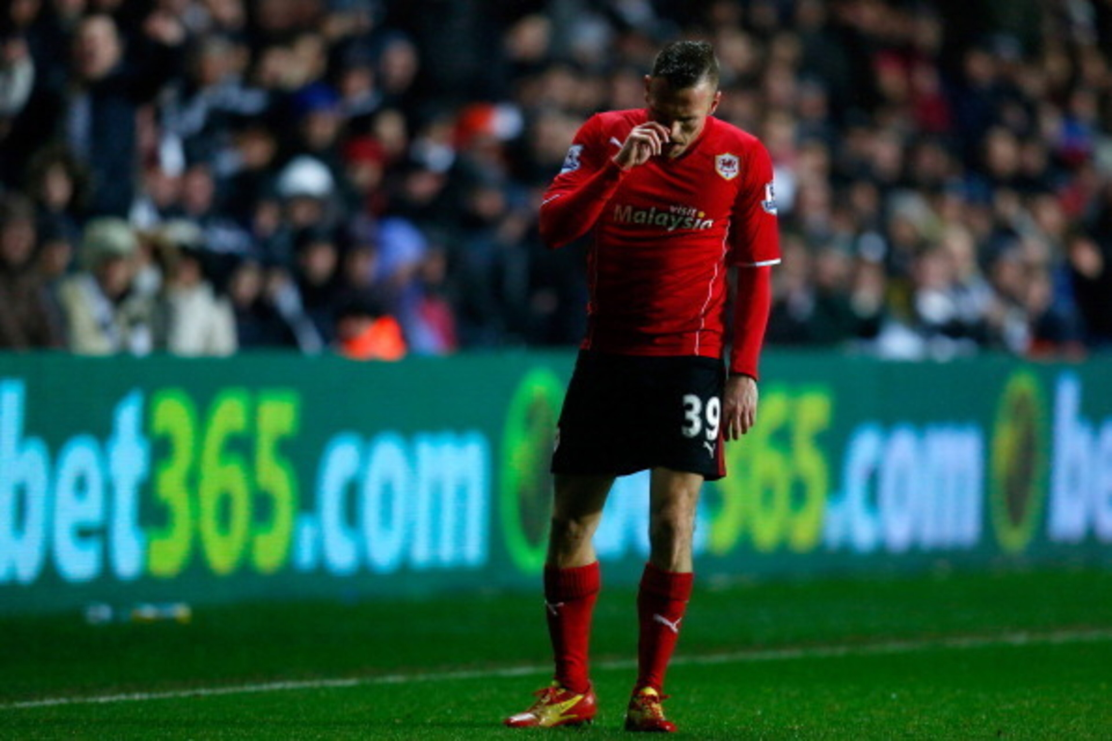 SWANSEA, WALES - FEBRUARY 08: Craig Bellamy of Cardiff shows his dejection during the Barclays Premier League match between Swansea City and Cardiff City at the Liberty Stadium on February 8, 2014 in Swansea, Wales. (Photo by Paul Thomas/Getty Images)