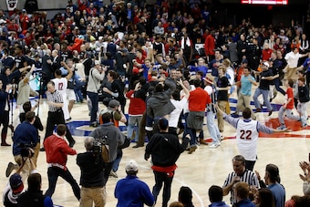 Feb 8, 2014; Dallas, TX, USA; Fans rush the court following Southern Methodist Mustangs win over the Cincinnati Bearcats at Moody Coliseum. SMU won 76-55. Mandatory Credit: Jim Cowsert-USA TODAY Sports