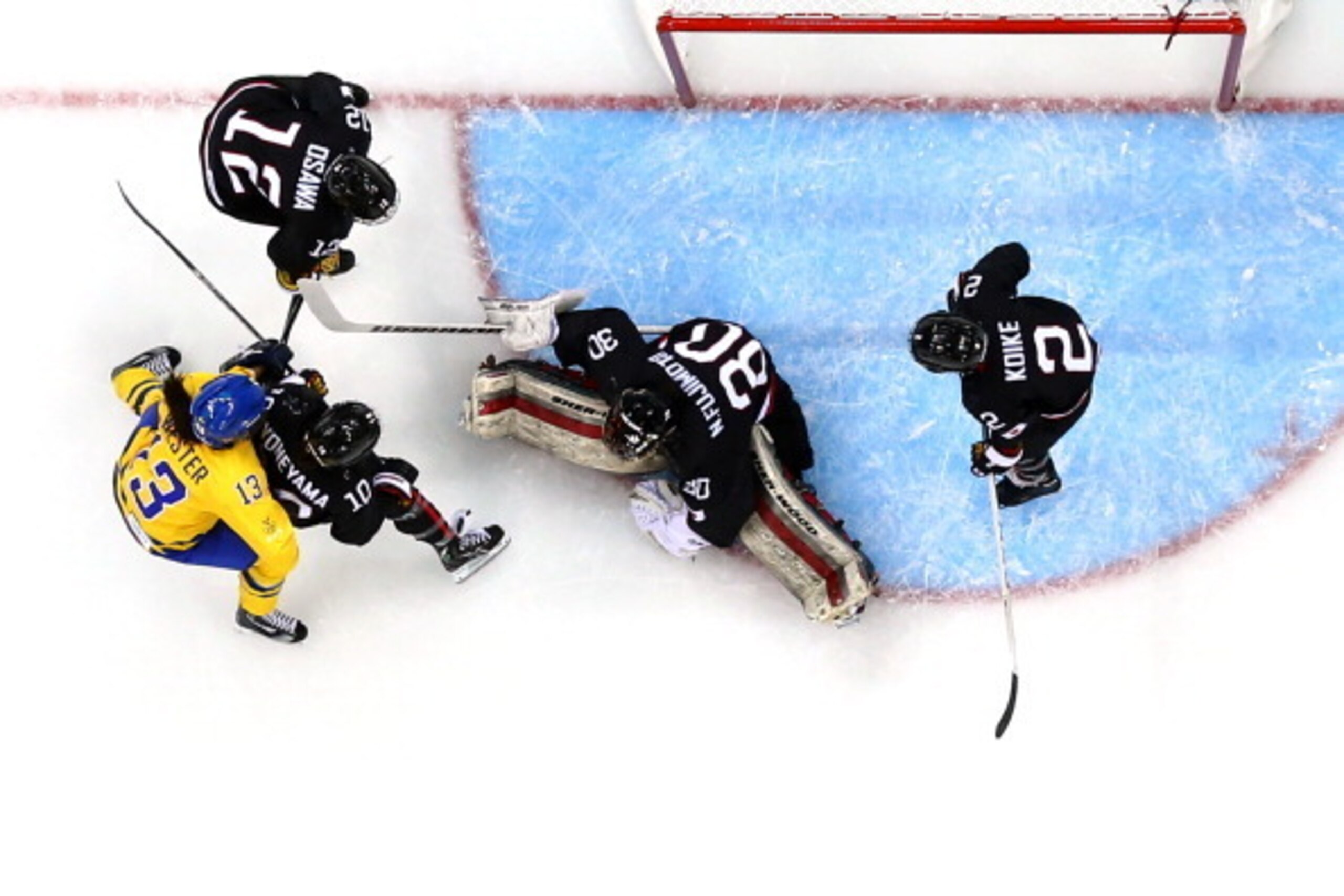 SOCHI, RUSSIA - FEBRUARY 09:  Nana Fujimoto #30 of Japan makes a save during the Women's Ice Hockey Preliminary Round Group B Game on day two of the Sochi 2014 Winter Olympics at Shayba Arena on February 9, 2014 in Sochi, Russia.  (Photo by Martin Rose/Ge