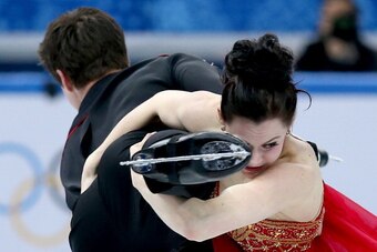SOCHI, RUSSIA - FEBRUARY 09:  Tessa Virtue and Scott Moir of Canada competes in the Team Ladies Free Skating during day two of the Sochi 2014 Winter Olympics at Iceberg Skating Palace onon February 9, 2014 in Sochi, Russia.  (Photo by Matthew Stockman/Get