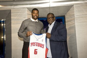 AUBURN HILLS - JULY 10:  Joe Dumars, President of Basketball Operations (R) poses with new Detroit Piston, Josh Smith and his new jersey at a press conference on July 10, 2013 at Palace of Auburn Hills in Auburn Hills, Michigan. NOTE TO USER: User express