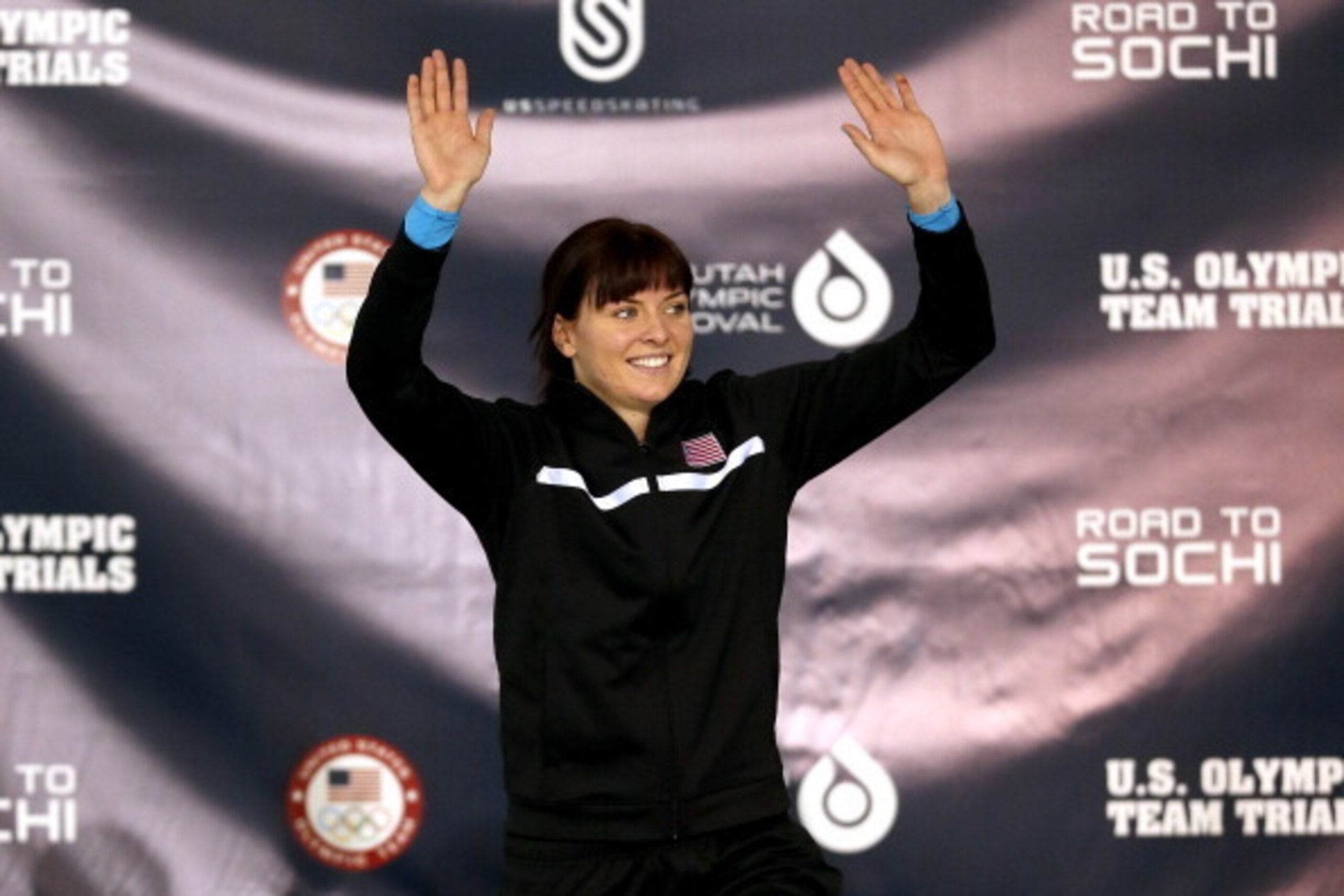 SALT LAKE CITY, UT - DECEMBER 28:  Heather Richardson celebrates on the medals podium afterwinning the ladies 500 meter during the U.S. Speed Skating Long Track Olympic Trials at the Utah Olympic Oval on December 28, 2013 in Salt Lake City, Utah.  (Photo 