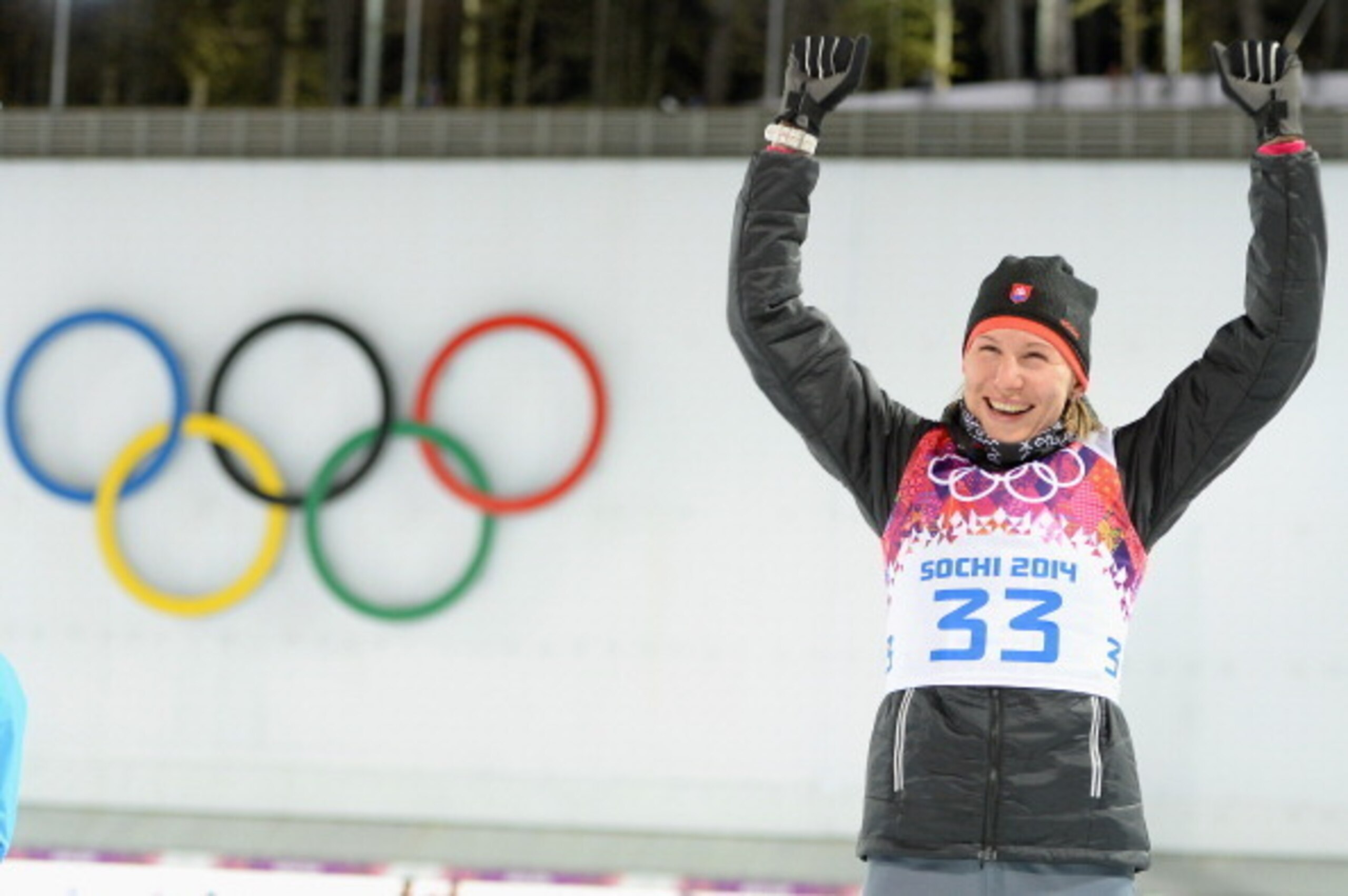 SOCHI, RUSSIA - FEBRUARY 09: Gold medalist Anastasiya Kuzmina of Slovakia celebrates during the flower ceremony after the Women's 7.5 km Sprint during day two of the Sochi 2014 Winter Olympics at Laura Cross-country Ski & Biathlon Center on February 9, 2 SOCHI, RUSSIA - FEBRUARY 09: Gold medalist Anastasiya Kuzmina of Slovakia celebrates during the flower ceremony after the Women's 7.5 km Sprint during day two of the Sochi 2014 Winter Olympics at Laura Cross-country Ski & Biathlon Center on February 9, 2