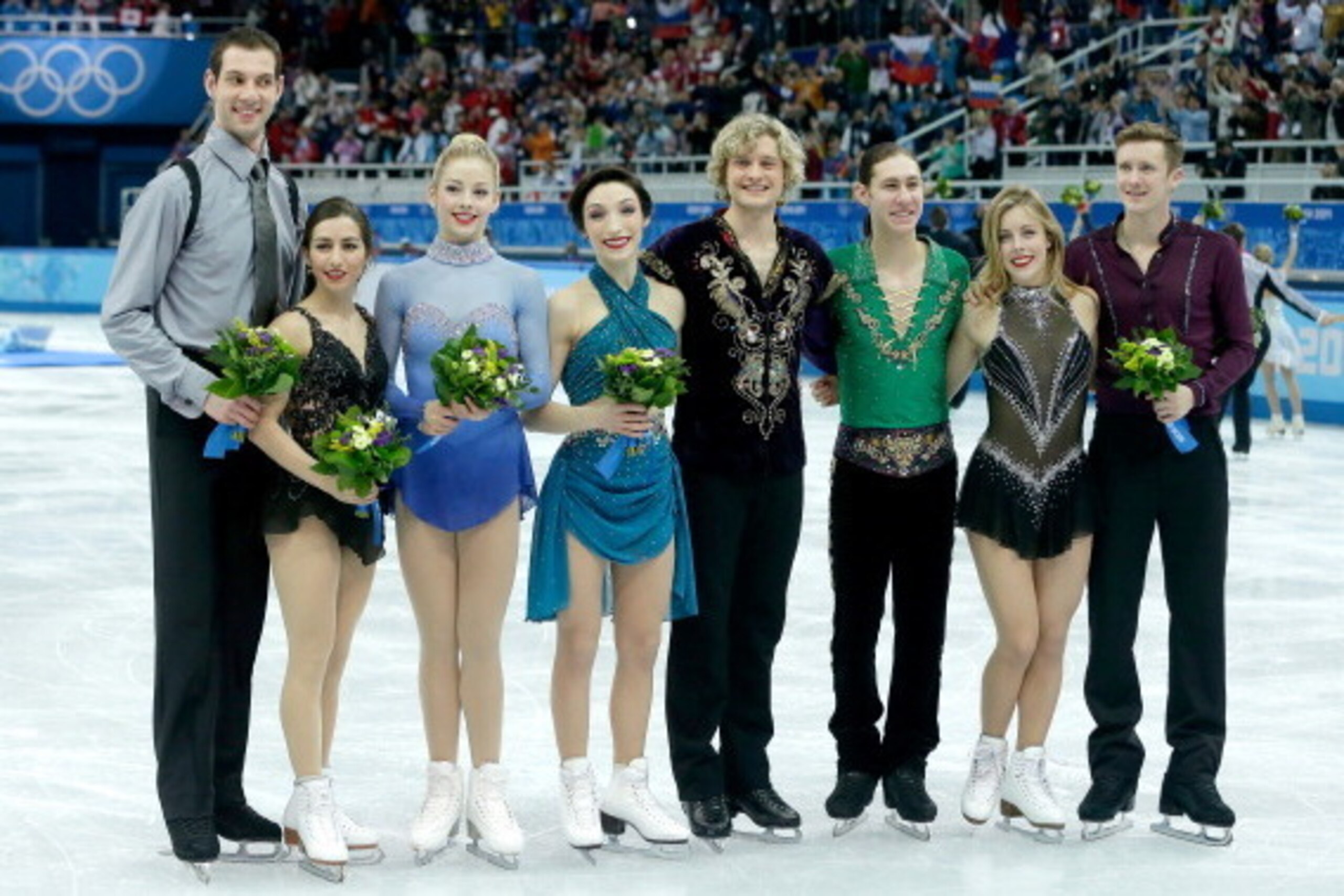 SOCHI, RUSSIA - FEBRUARY 09:  (L-R) Bronze medalists the United States Simon Shnapir, Maria Castelli, Gracie Gold, Meryl Davis, Charlie White, Jason Brown, Ashley Wagner and Jeremy Abbott pose after the flower ceremony for the competes in the Team Ladies 
