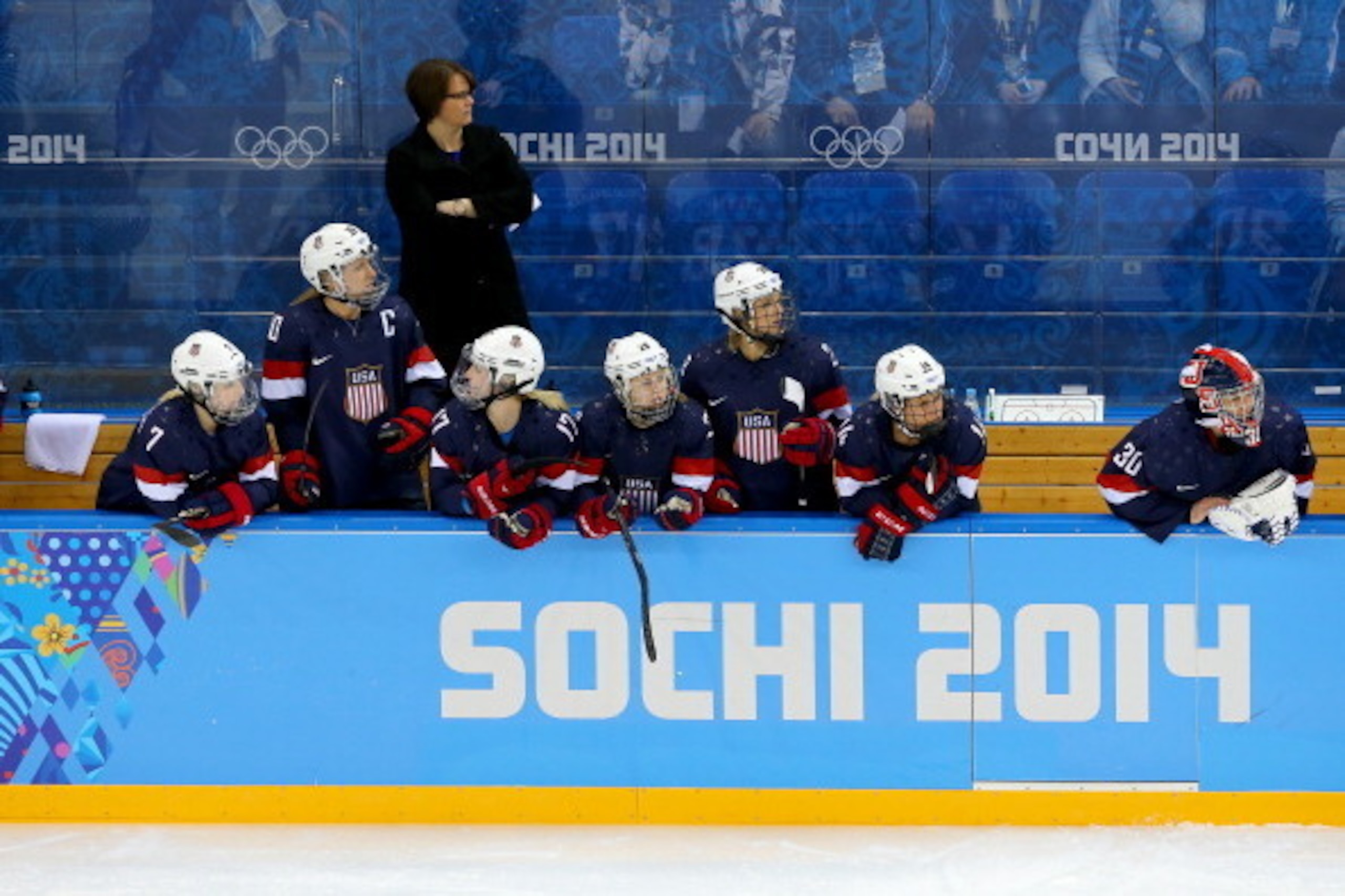 SOCHI, RUSSIA - FEBRUARY 08:  Head coach Katey Stone of the United States looks on from the bench during the Women's Ice Hockey Preliminary Round Group A Game against Finland on day 1 of the Sochi 2014 Winter Olympics at Shayba Arena on February 8, 2014 i