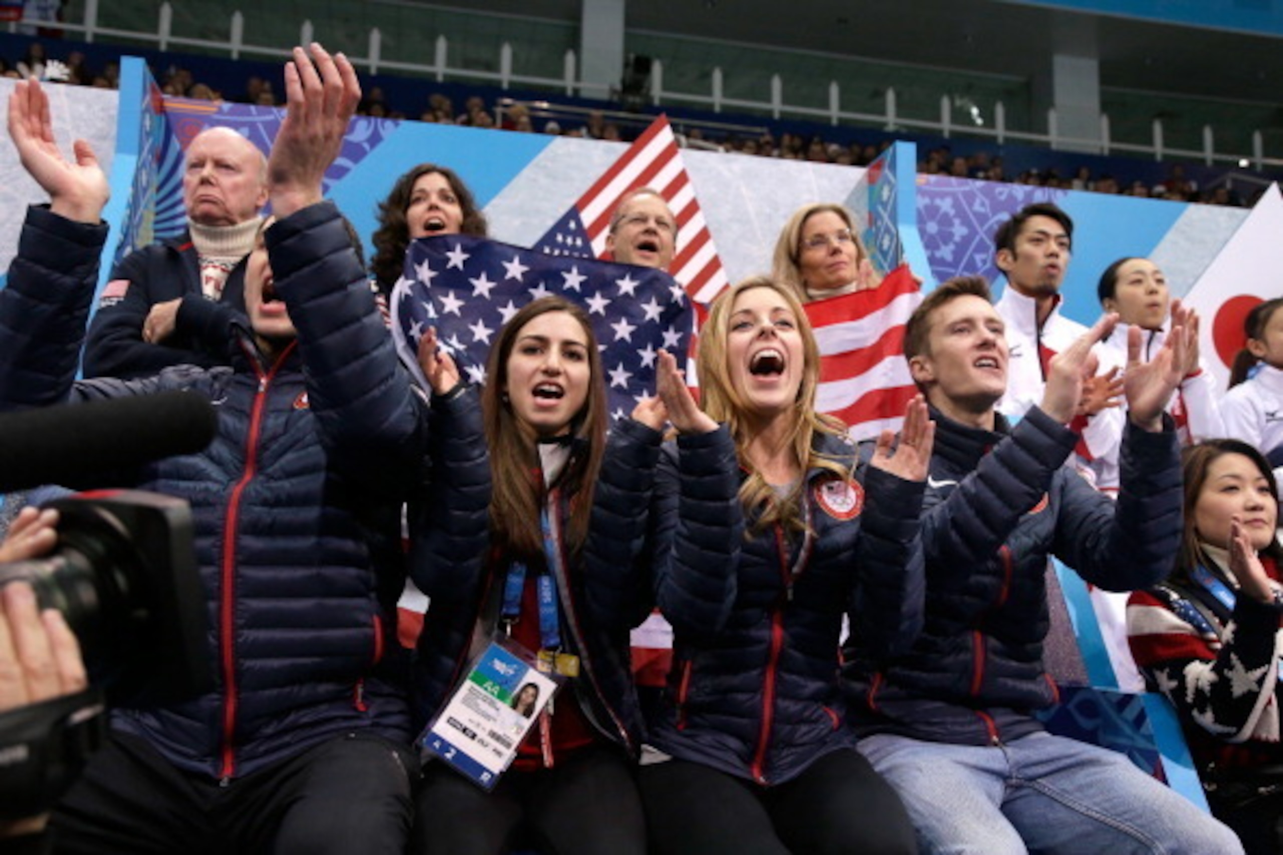 SOCHI, RUSSIA - FEBRUARY 09: (L-R) Figure skaters Marissa Castelli, Ashley Wagner and Jeremy Abbott cheer as teammate Jason Brown of the United States competes in the Men's Figure Skating Men's Free Skate during day two of the Sochi 2014 Winter Olympics a