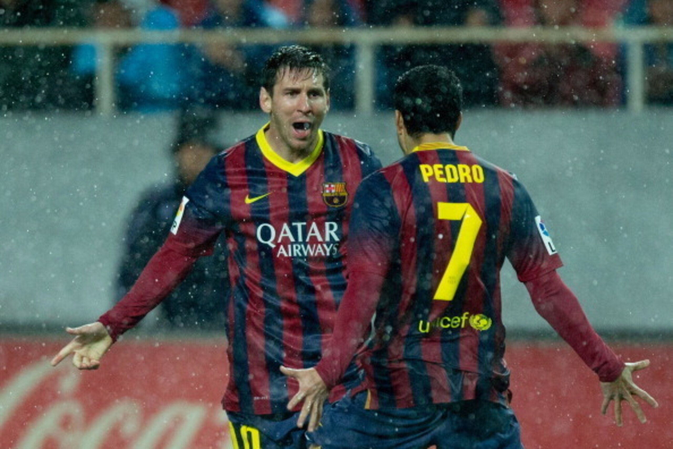 SEVILLE, SPAIN - FEBRUARY 09:  Lionel Messi of FC Barcelona celebrates scoring their second goal during the La Liga match between Sevilla FC and FC Barcelona at Estadio Ramon Sanchez Pizjuan on February 9, 2014 in Seville, Spain.  (Photo by Gonzalo Arroyo