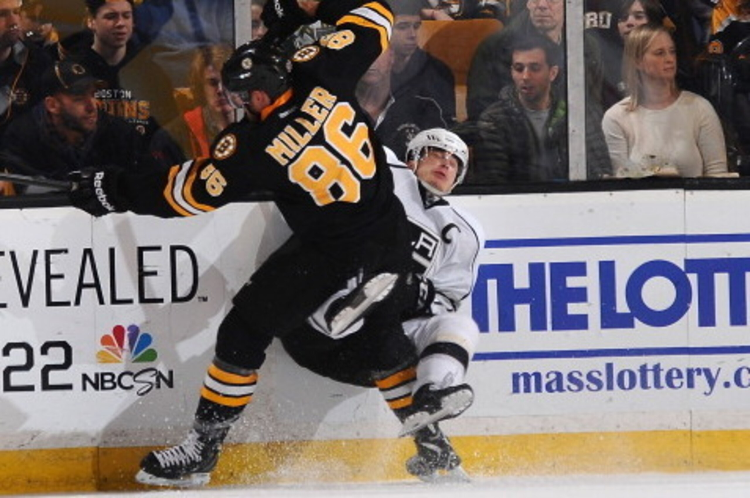 BOSTON, MA - JANUARY 20: Kevan Miller #86 of the Boston Bruins checks against Dustin Brown #23 of the Los Angeles Kings at the TD Garden on January 20, 2014 in Boston, Massachusetts.  (Photo by Brian Babineau/NHLI via Getty Images)