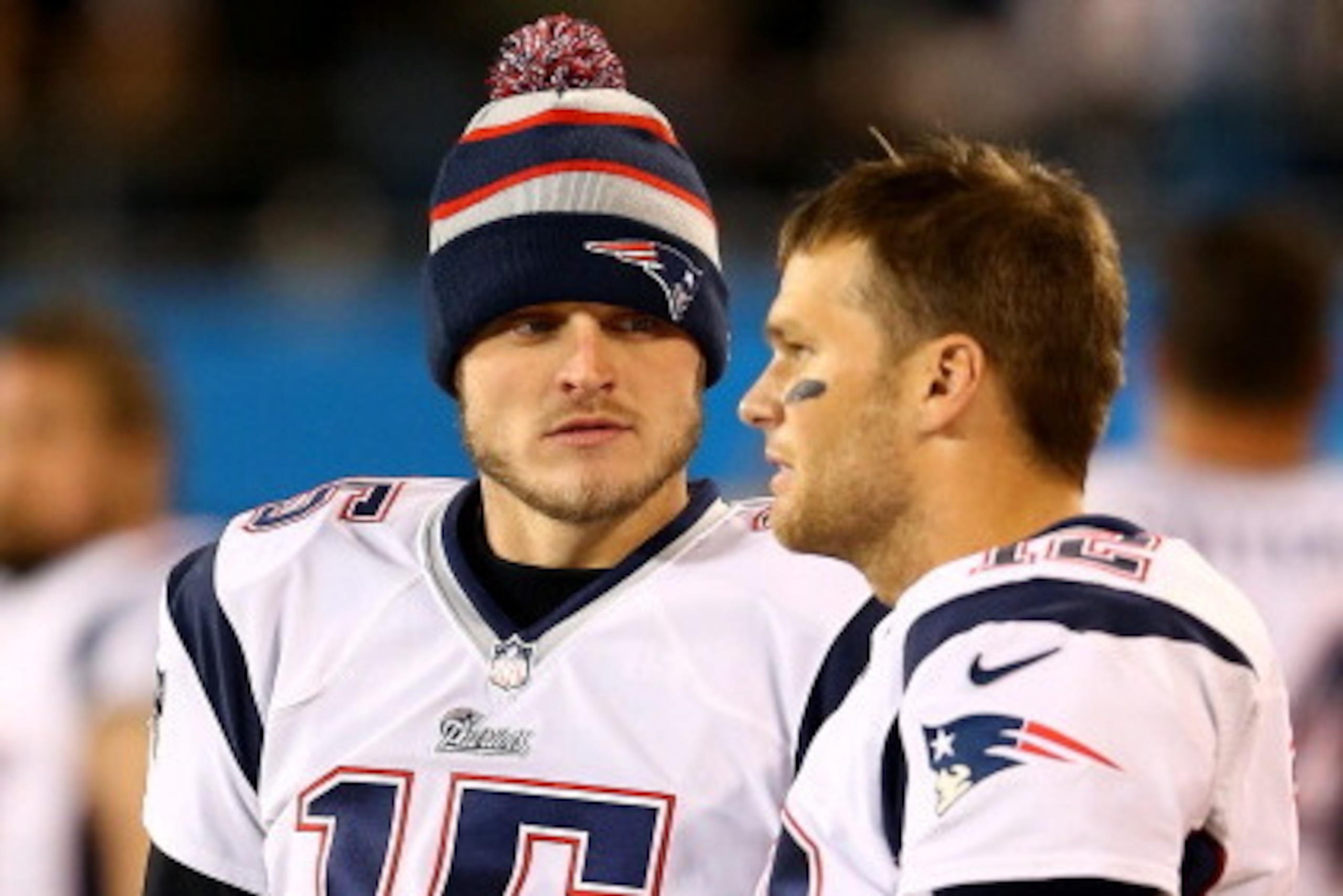 CHARLOTTE, NC - NOVEMBER 18:  Teammates  Ryan Mallett #15 and  Tom Brady #12 of the New England Patriots during their game at Bank of America Stadium on November 18, 2013 in Charlotte, North Carolina.  (Photo by Streeter Lecka/Getty Images)