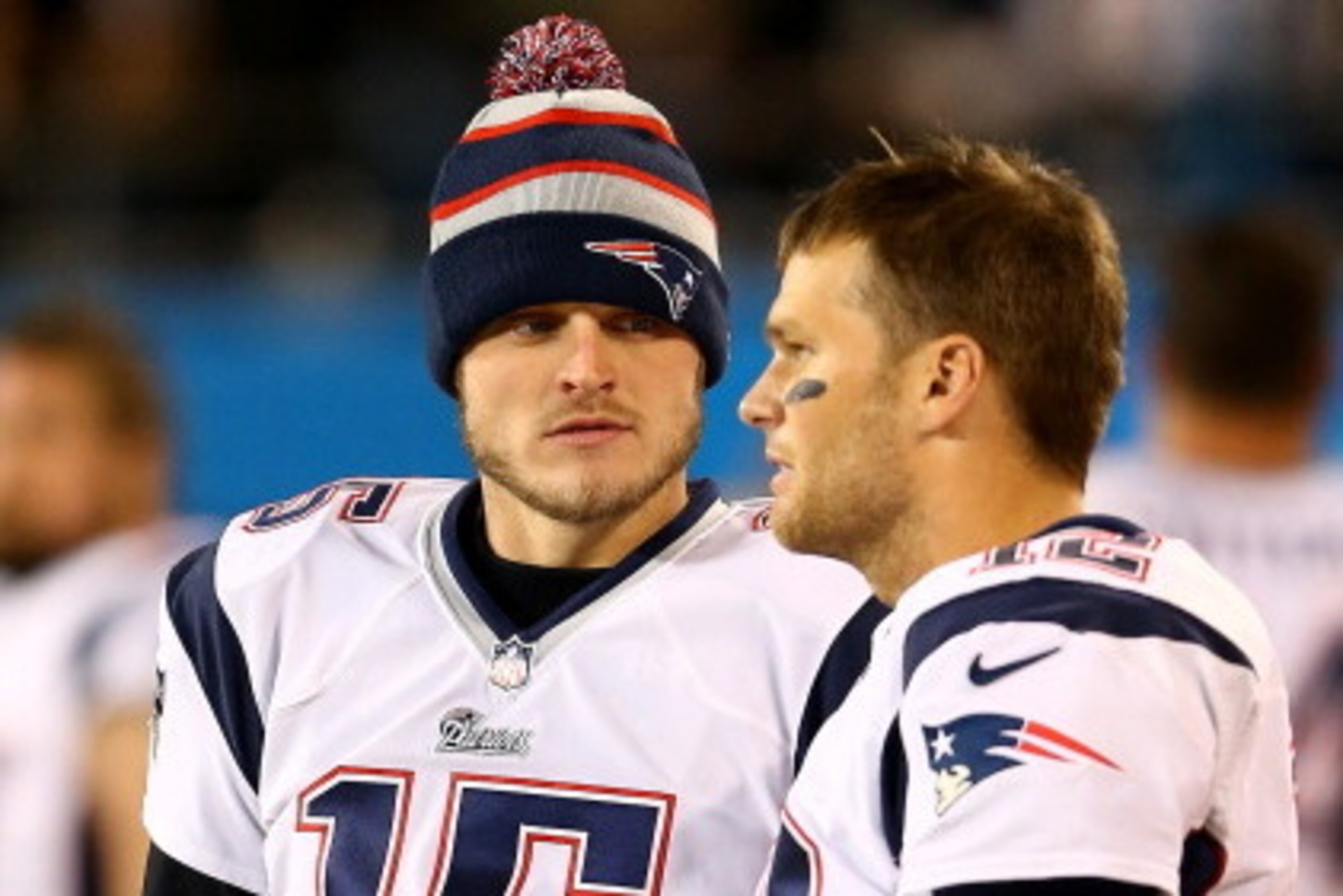 CHARLOTTE, NC - NOVEMBER 18:  Teammates  Ryan Mallett #15 and  Tom Brady #12 of the New England Patriots during their game at Bank of America Stadium on November 18, 2013 in Charlotte, North Carolina.  (Photo by Streeter Lecka/Getty Images)