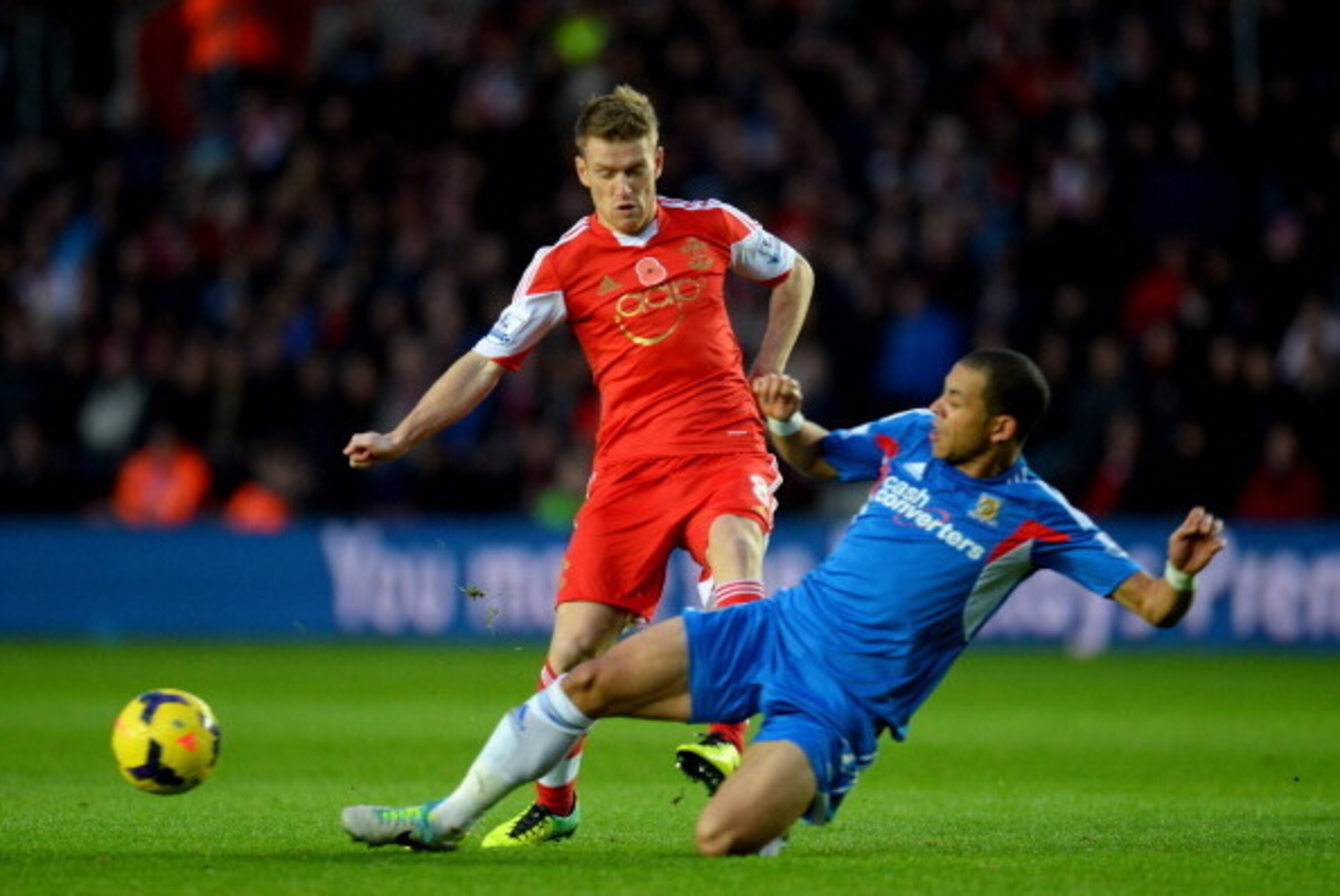SOUTHAMPTON, ENGLAND - NOVEMBER 09:  Steven Davis of Southampton is tackled by Liam Rosenior of Hull City during the Barclays Premier League match between Southampton and Hull City at St Mary's Stadium on November 9, 2013 in Southampton, England.  (Photo 